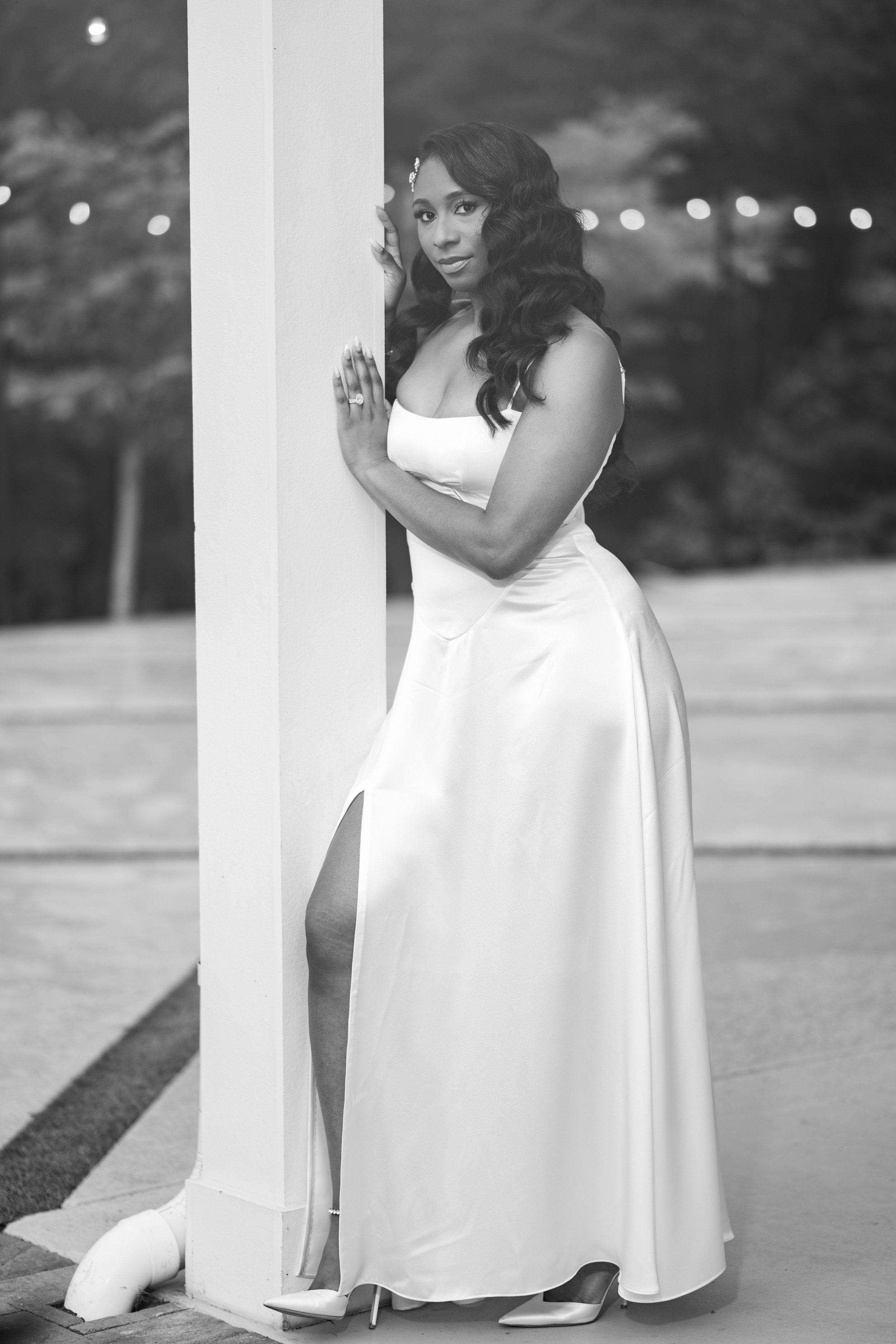 Bride posing in her reception dress for a black-and-white portrait at The Venue at Daisy Hill.