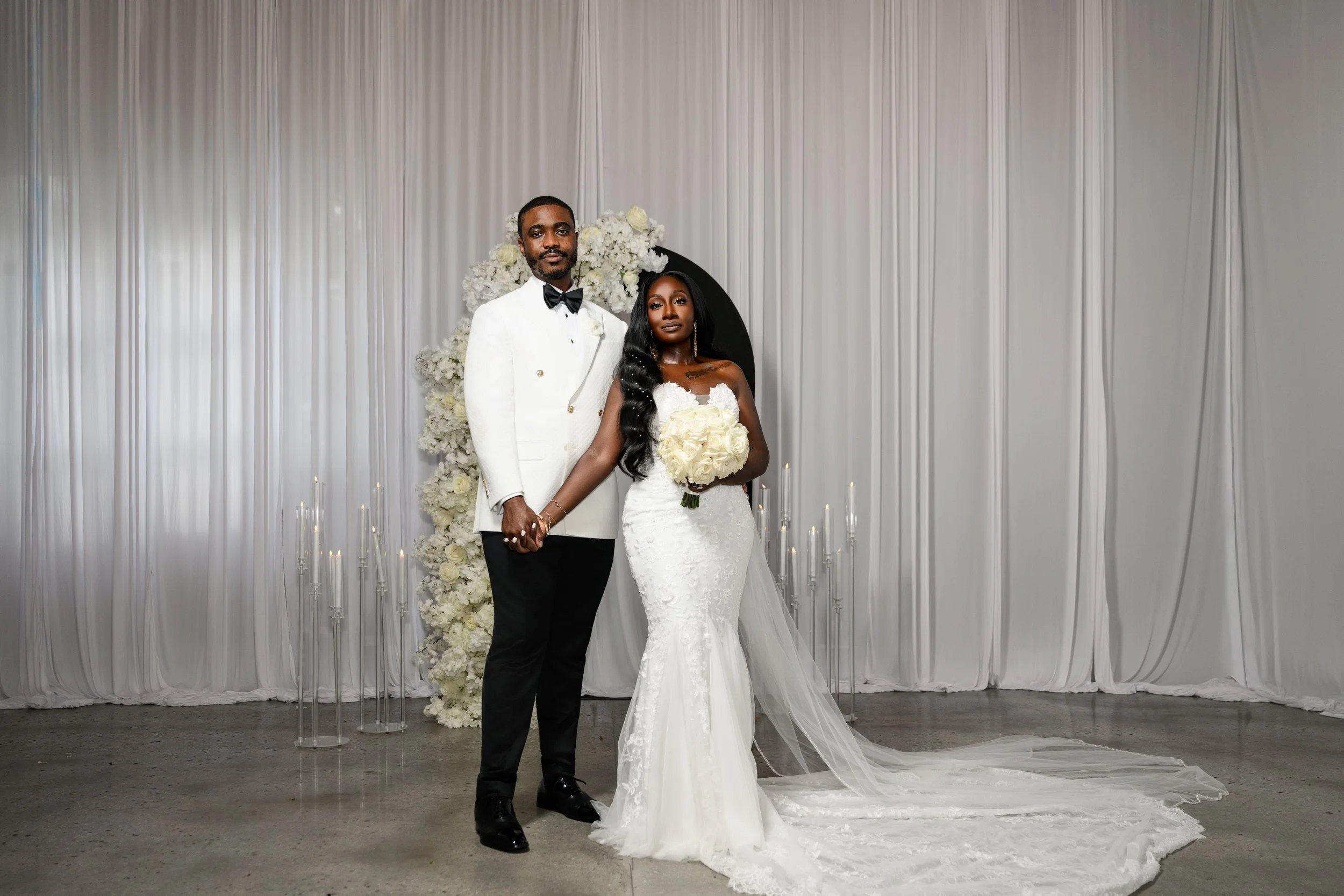 Full-length wedding portrait of Jalisa and Sadiq at The West Venue
