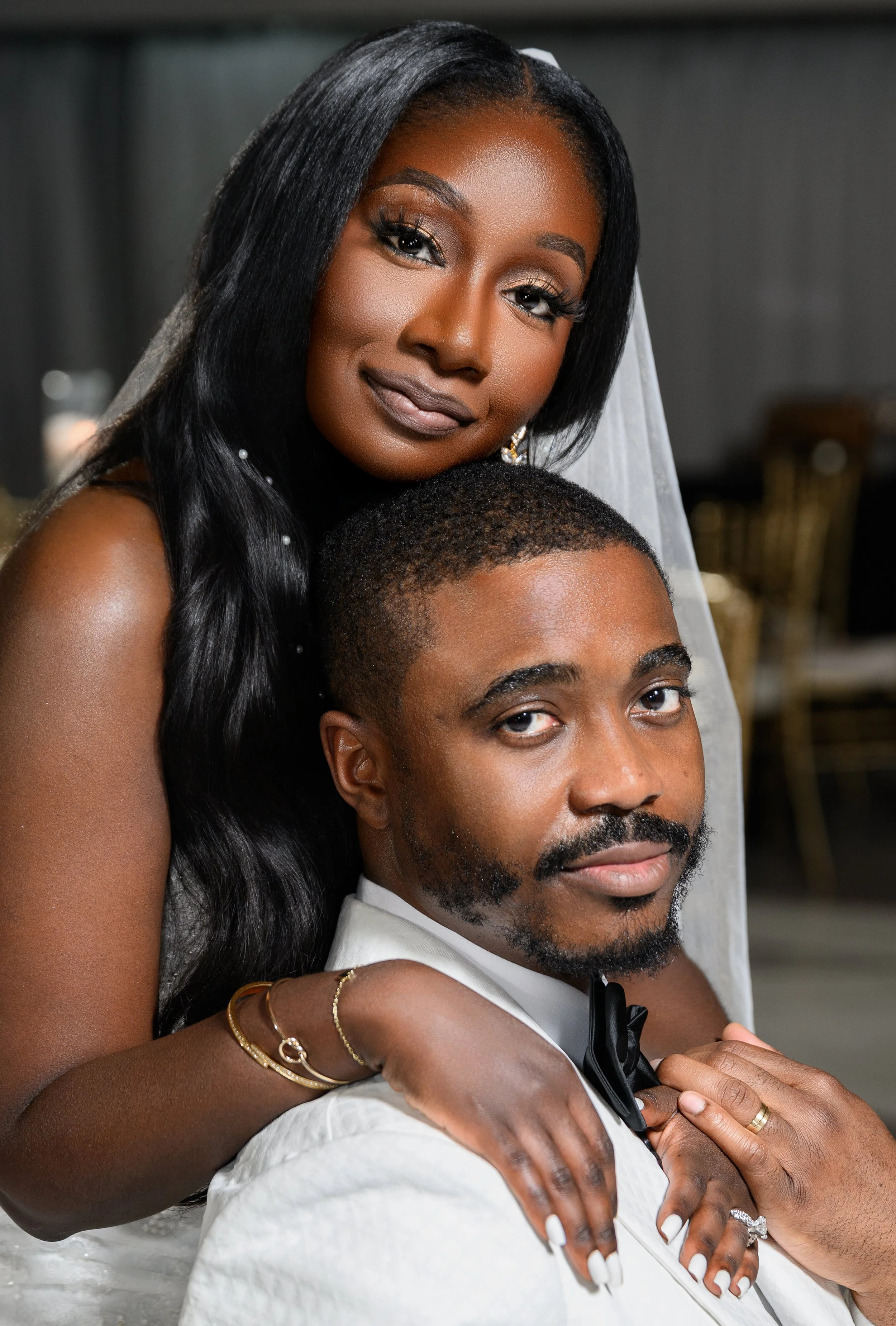 Jalisa embracing Sadiq during their wedding portraits at The West Venue in Atlanta