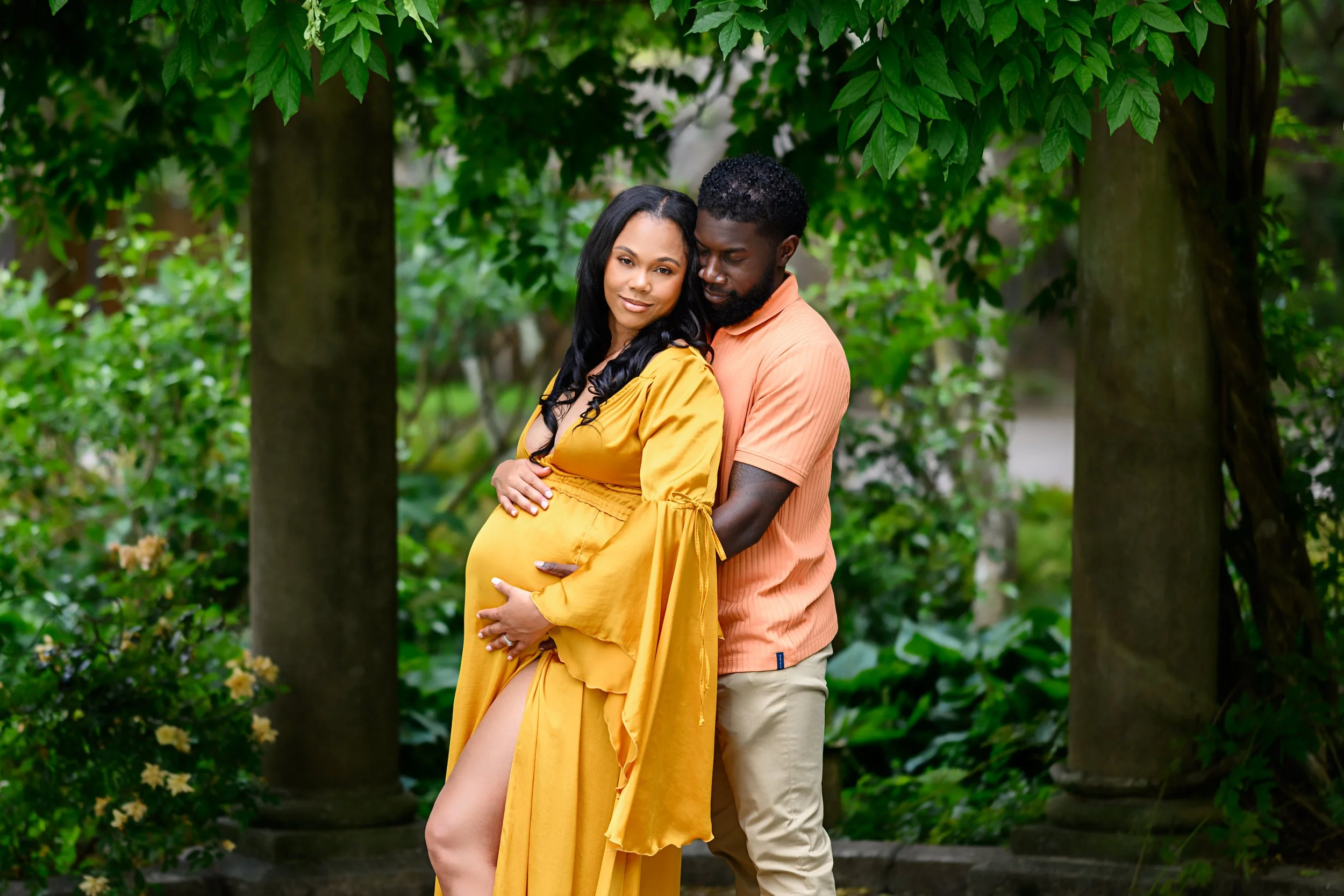 Expectant parents sharing a quiet moment together during their outdoor maternity session in Atlanta.