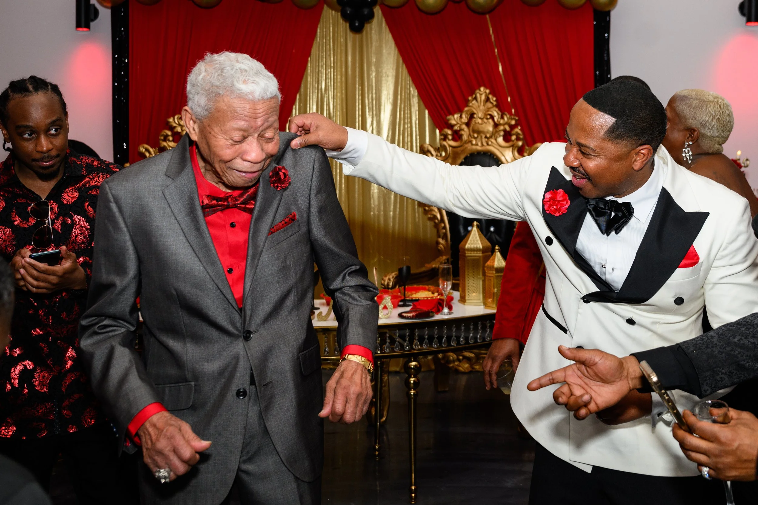 Warren sharing a fun dance-floor moment with family during his 50th birthday celebration in Atlanta.