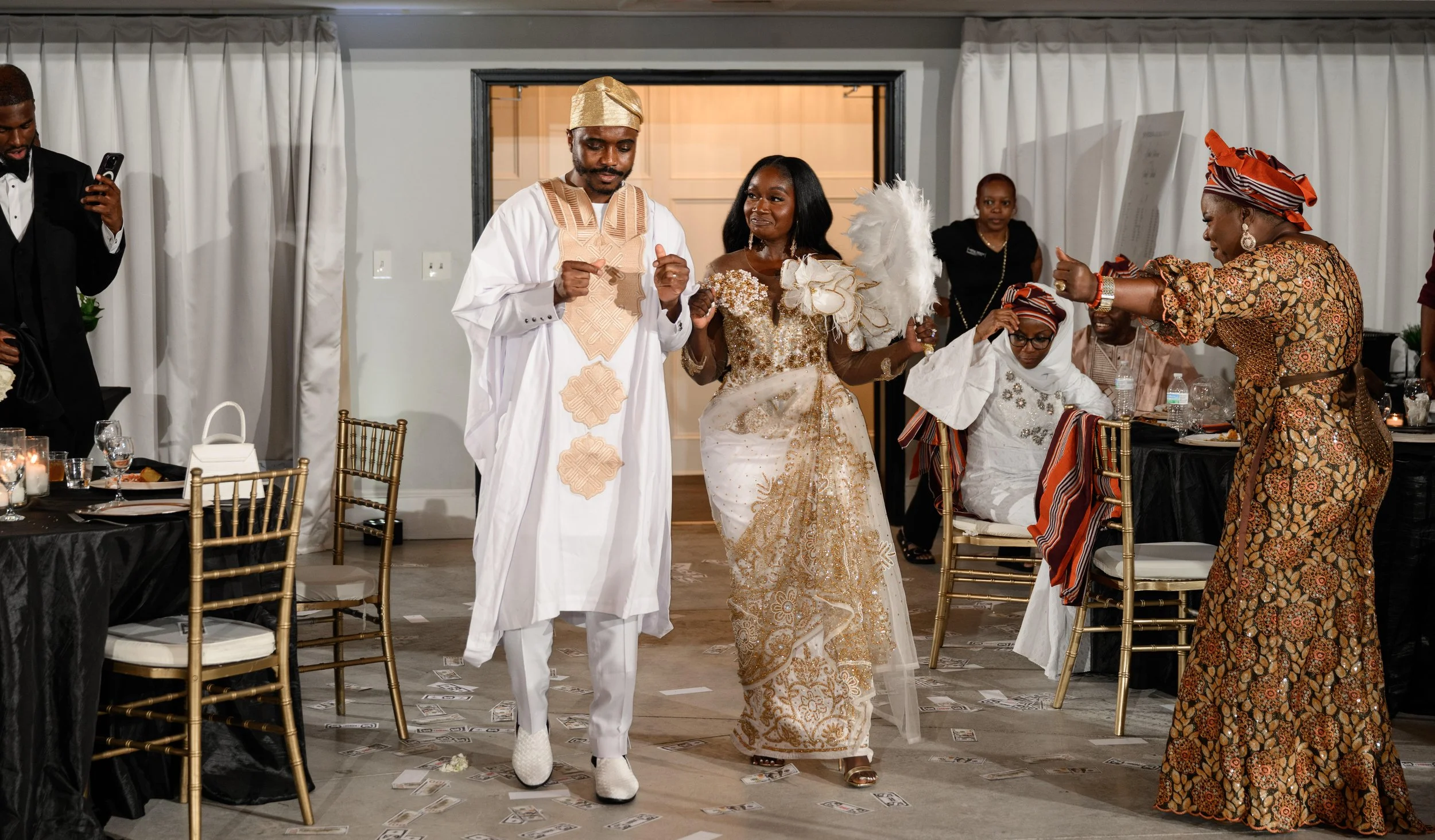 Jalisa and Sadiq celebrating during their Nigerian wedding reception