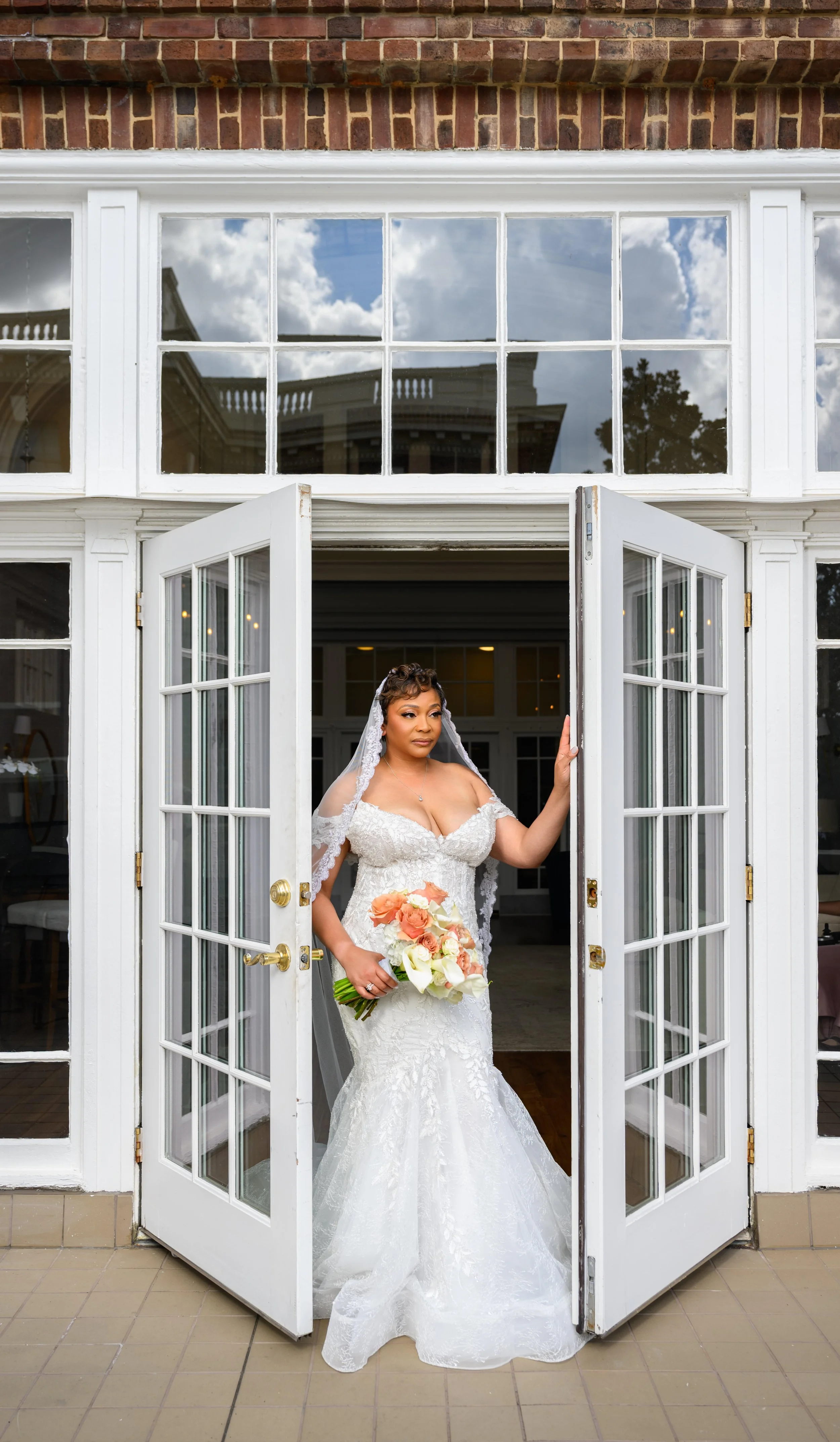 Bride posing in her wedding gown at Georgian Hall in Athens.