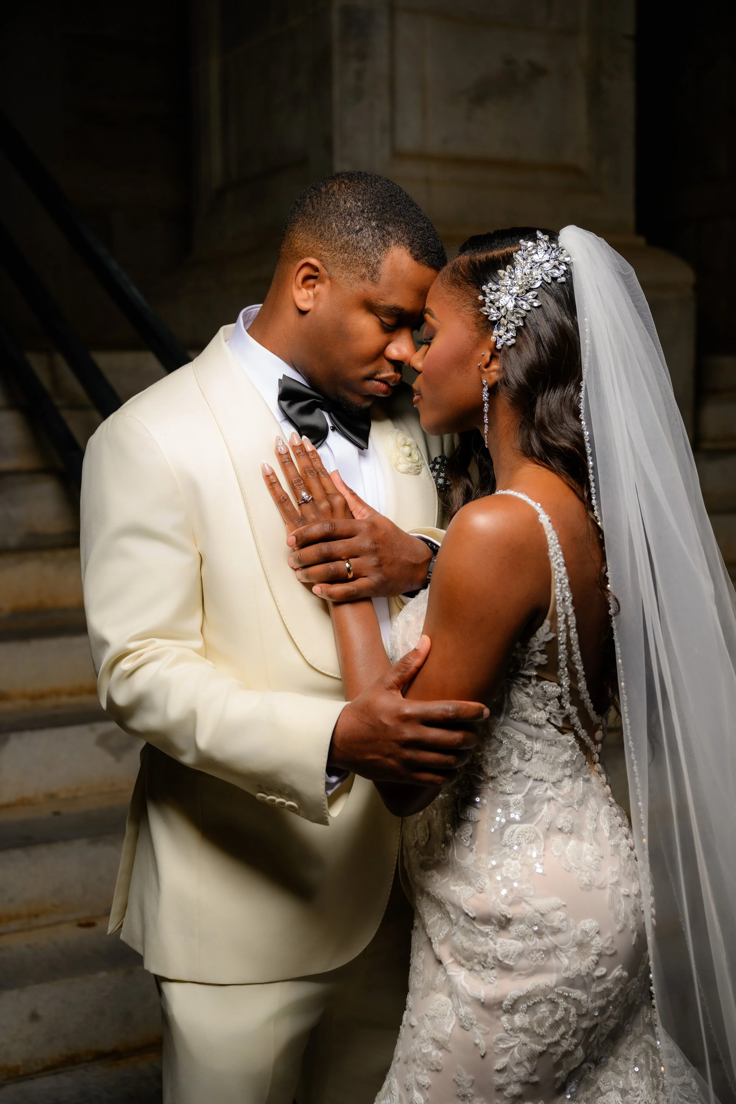 Bride and groom sharing an intimate wedding portrait at the Historic DeKalb Courthouse in Decatur, Georgia, photographed by Crystal Artis Photography.
