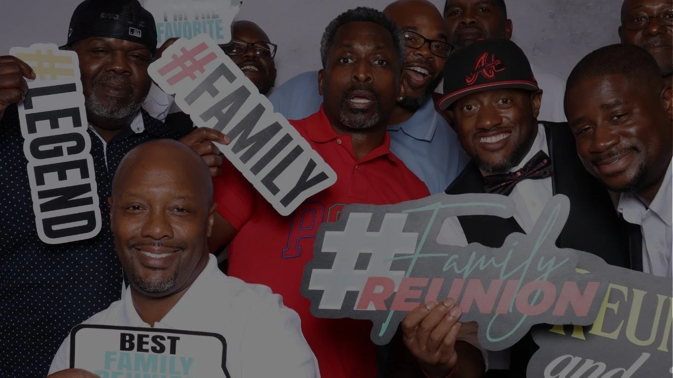 Family members posing together and enjoying The Artis Touch Photo Booth at a family reunion in Atlanta.