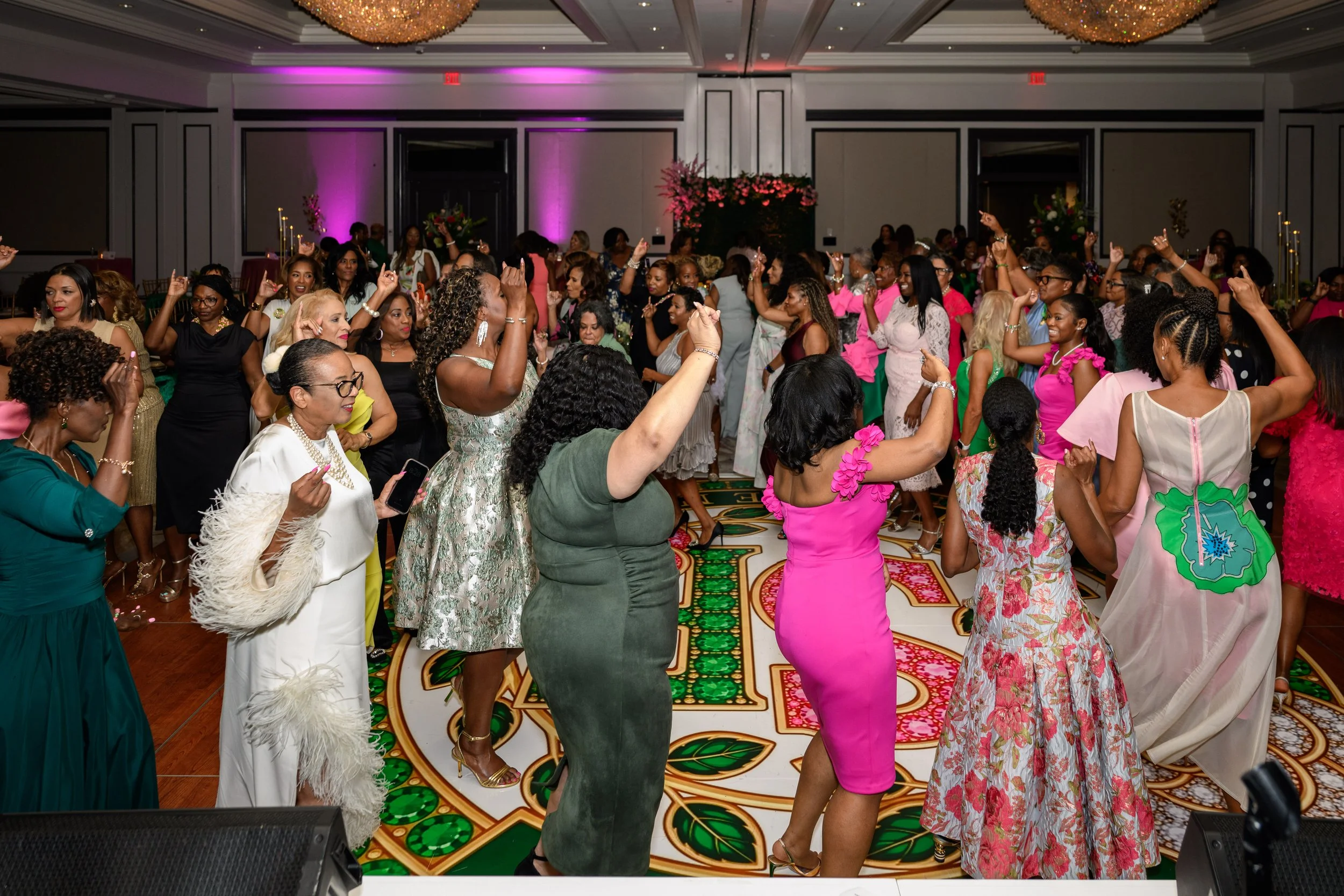 Guests celebrating on the dance floor during the Sister Friend Circle event at The Whitley Hotel in Atlanta.