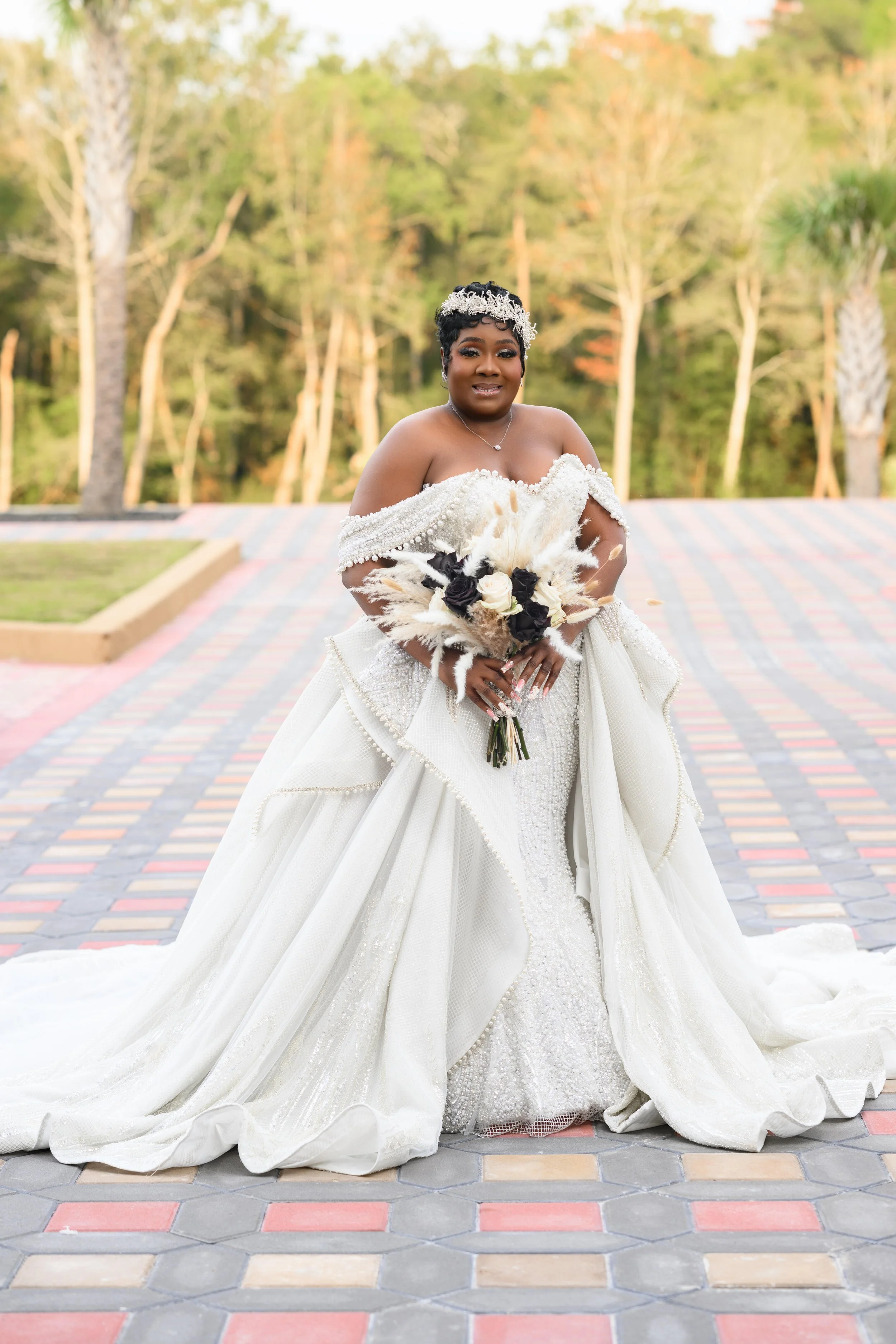Bride holding her bouquet during an outdoor bridal portrait at Shahbain Events Center in North Carolina.