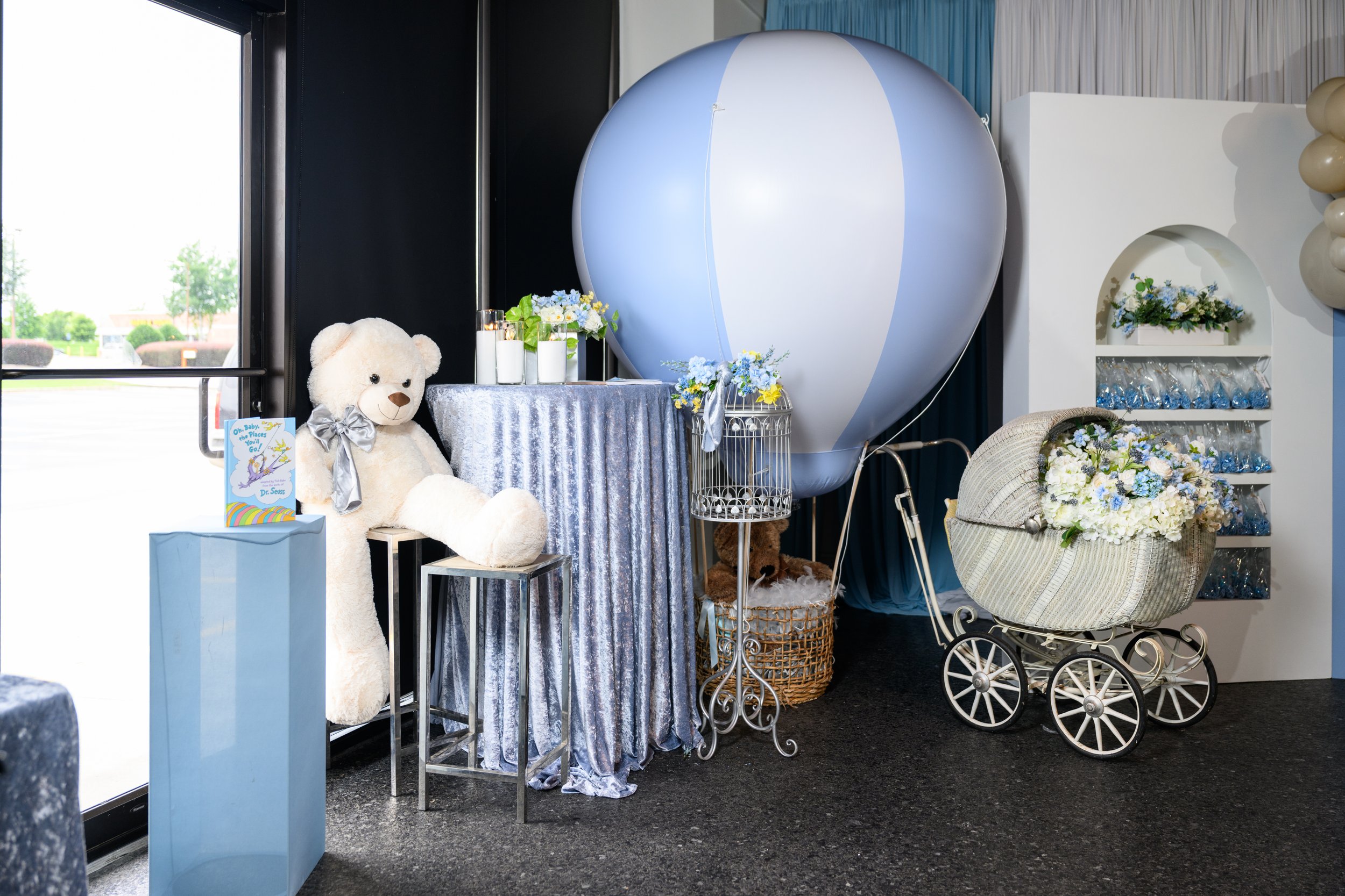 Hot air balloon, teddy bear and floral decor created for an Up, Up and Away baby shower in Flowery Branch, Georgia.