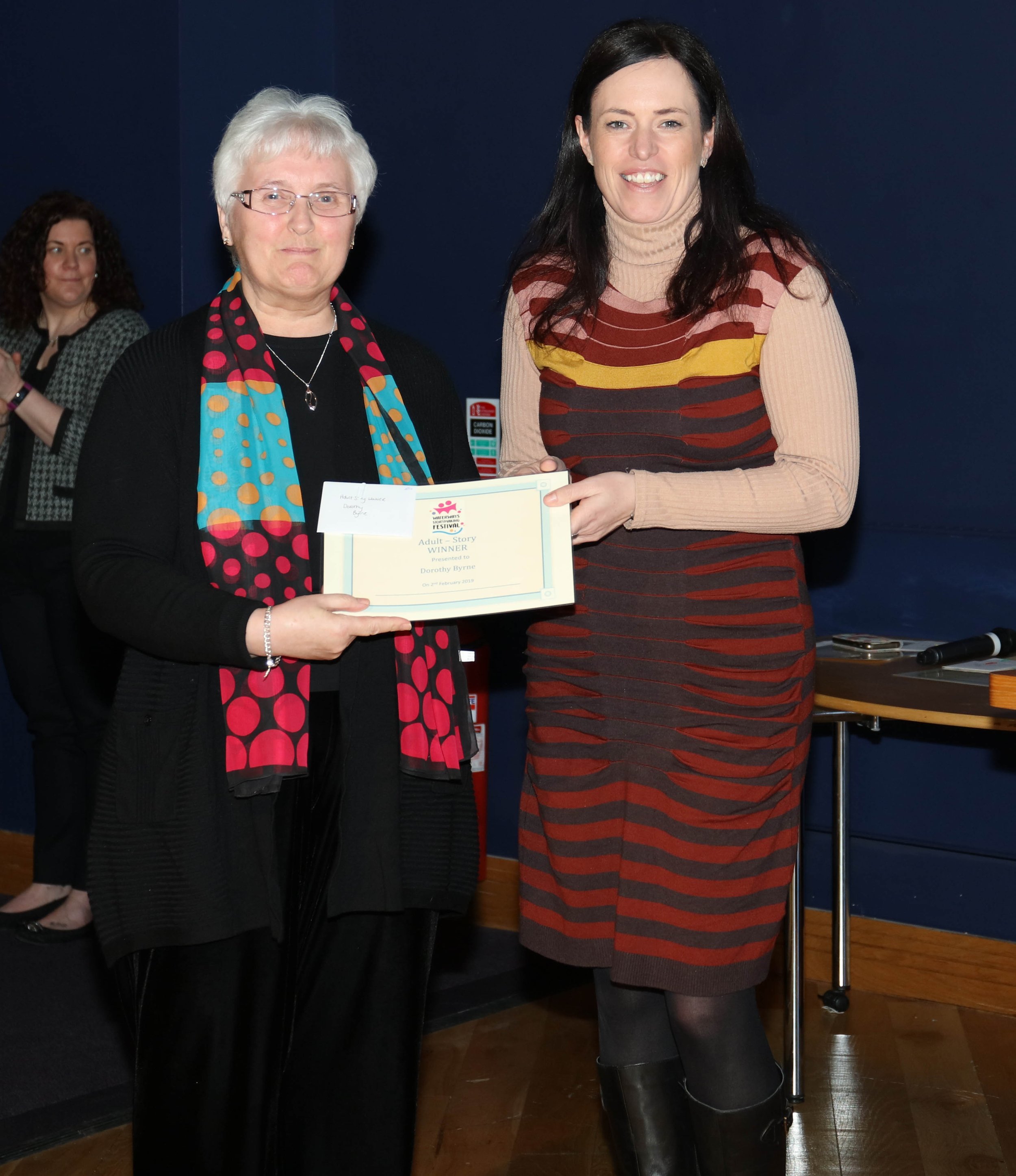 Suzanne Lutton presenting and Dorothy Byrne her competition winners certificate
