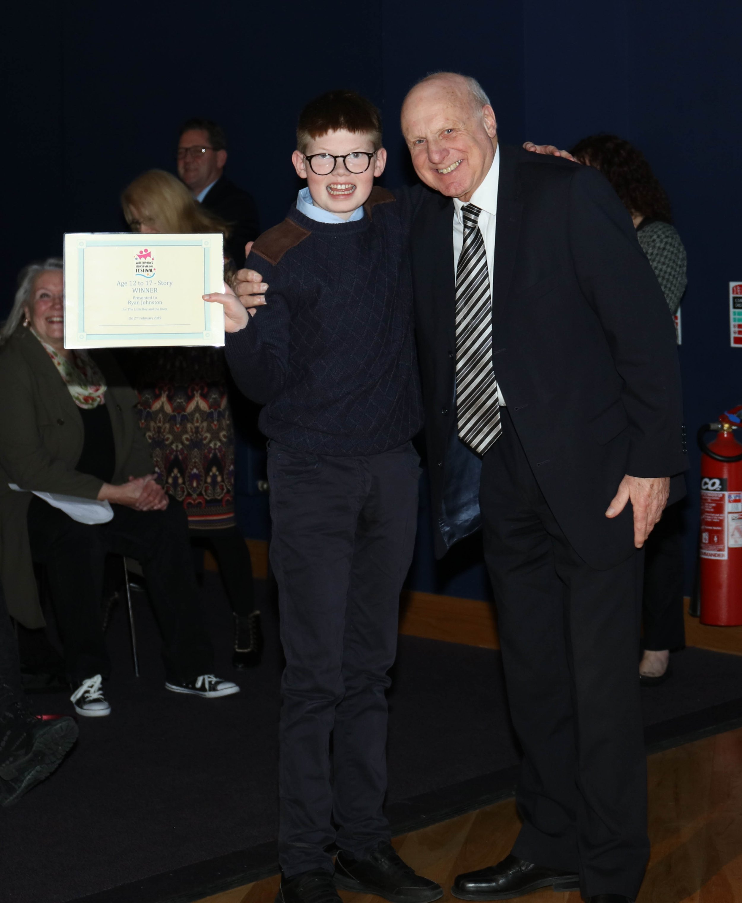 Former Chair of Lagan Navigation Trust, Brian Cassells and Ryan receiving his creative writing winners certificate