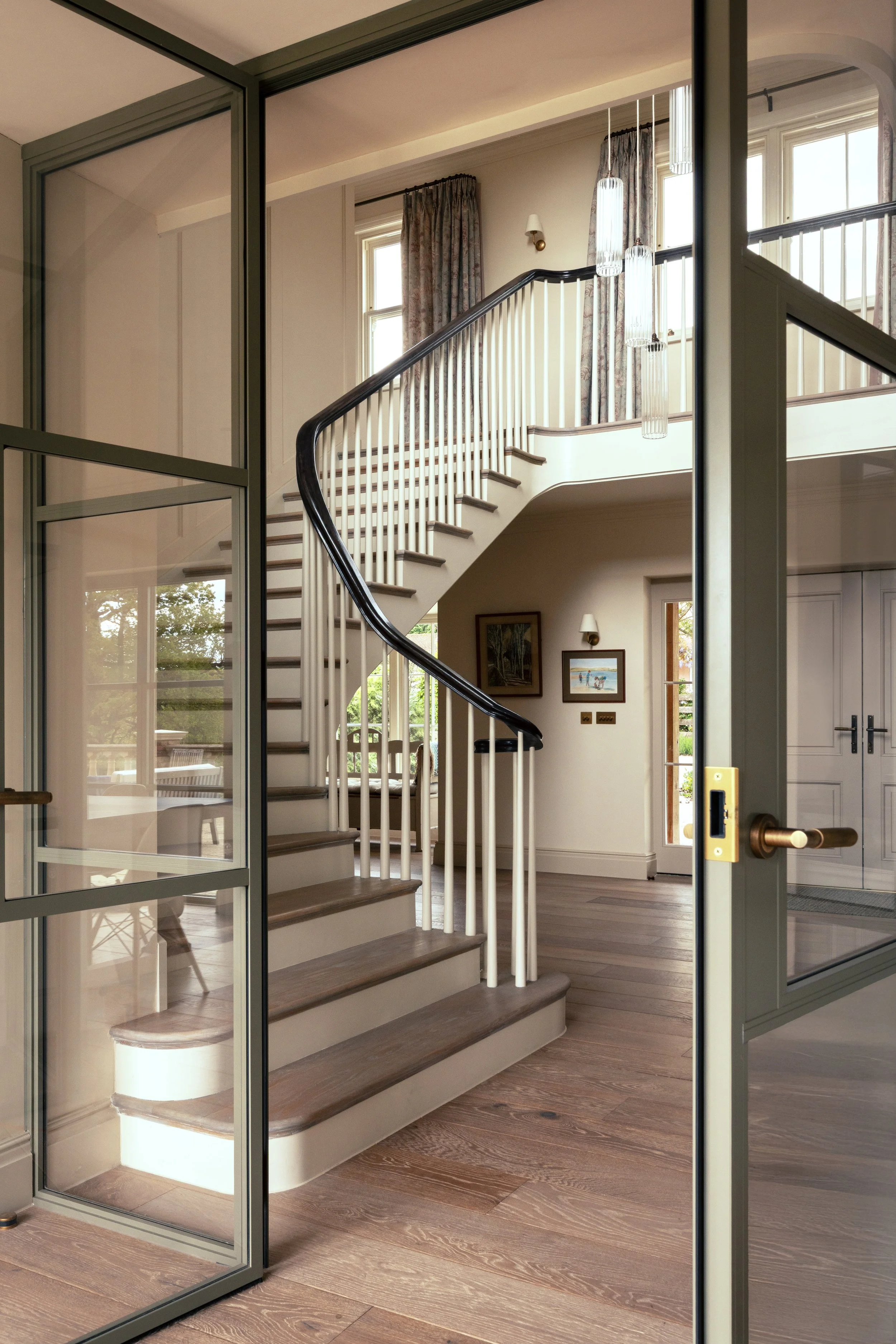 Modern architectural renovation of an existing countryside house, combining the original 1980s structure with a contemporary design approach.
