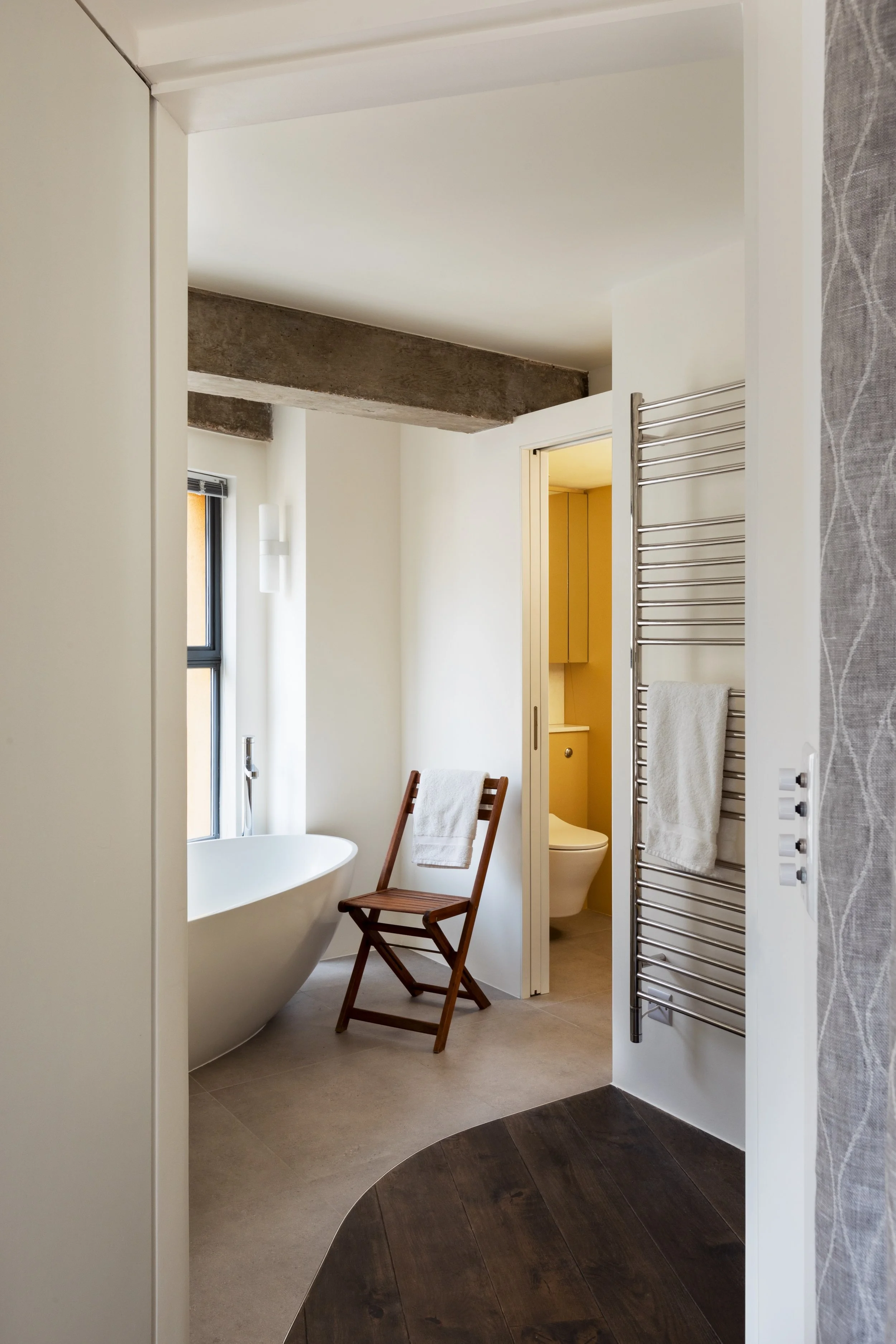 A high-end bathroom interior in London by Studio Tashima, featuring bespoke joinery, premium materials, and modern design detailing.