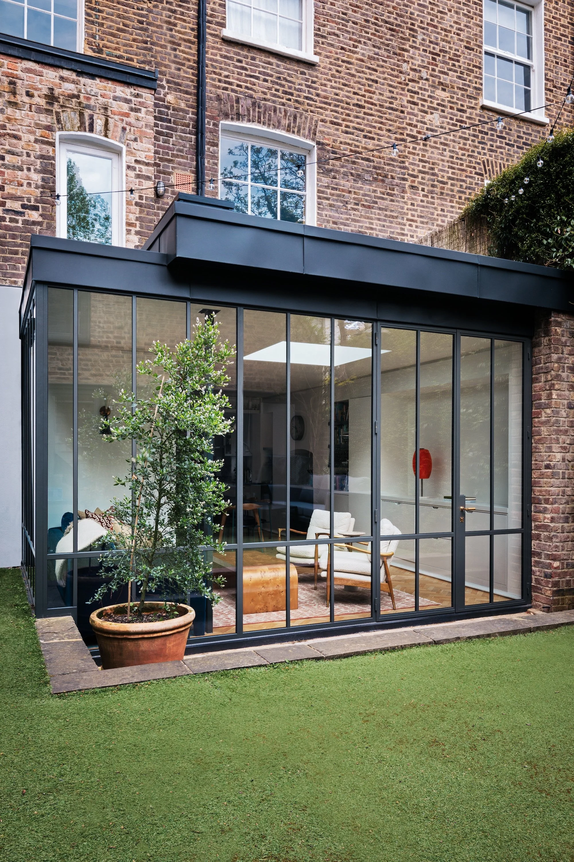 A rebuilt Victorian artist’s studio in London by Studio Tashima, featuring a striking double-height interior space.