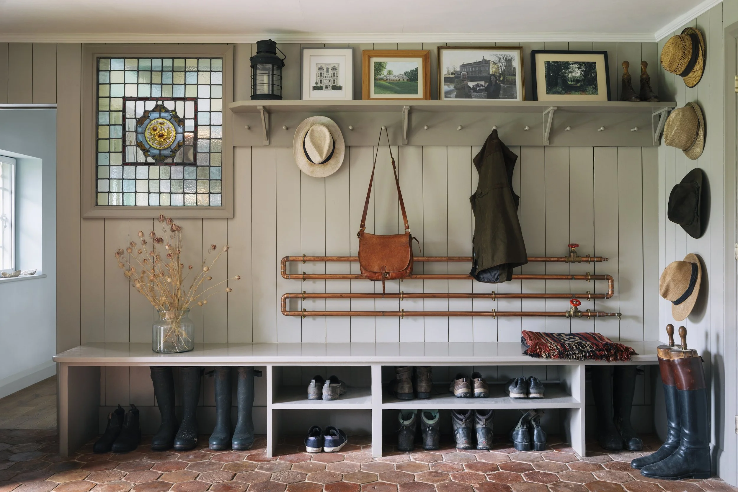 A rural farmhouse architectural renovation set within rolling hills and farmland near Berkshire, enhancing a traditional estate home through contemporary design. By Studio Tashima.