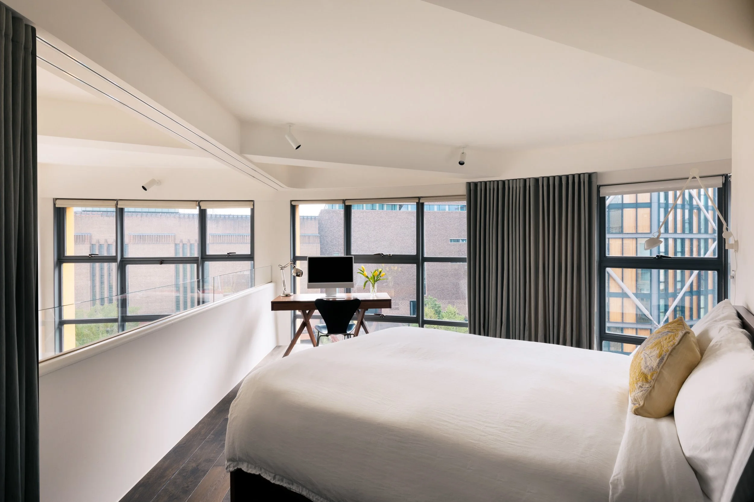 A contemporary bedroom design in a London home by Studio Tashima, blending modern materials with soft residential interiors.
