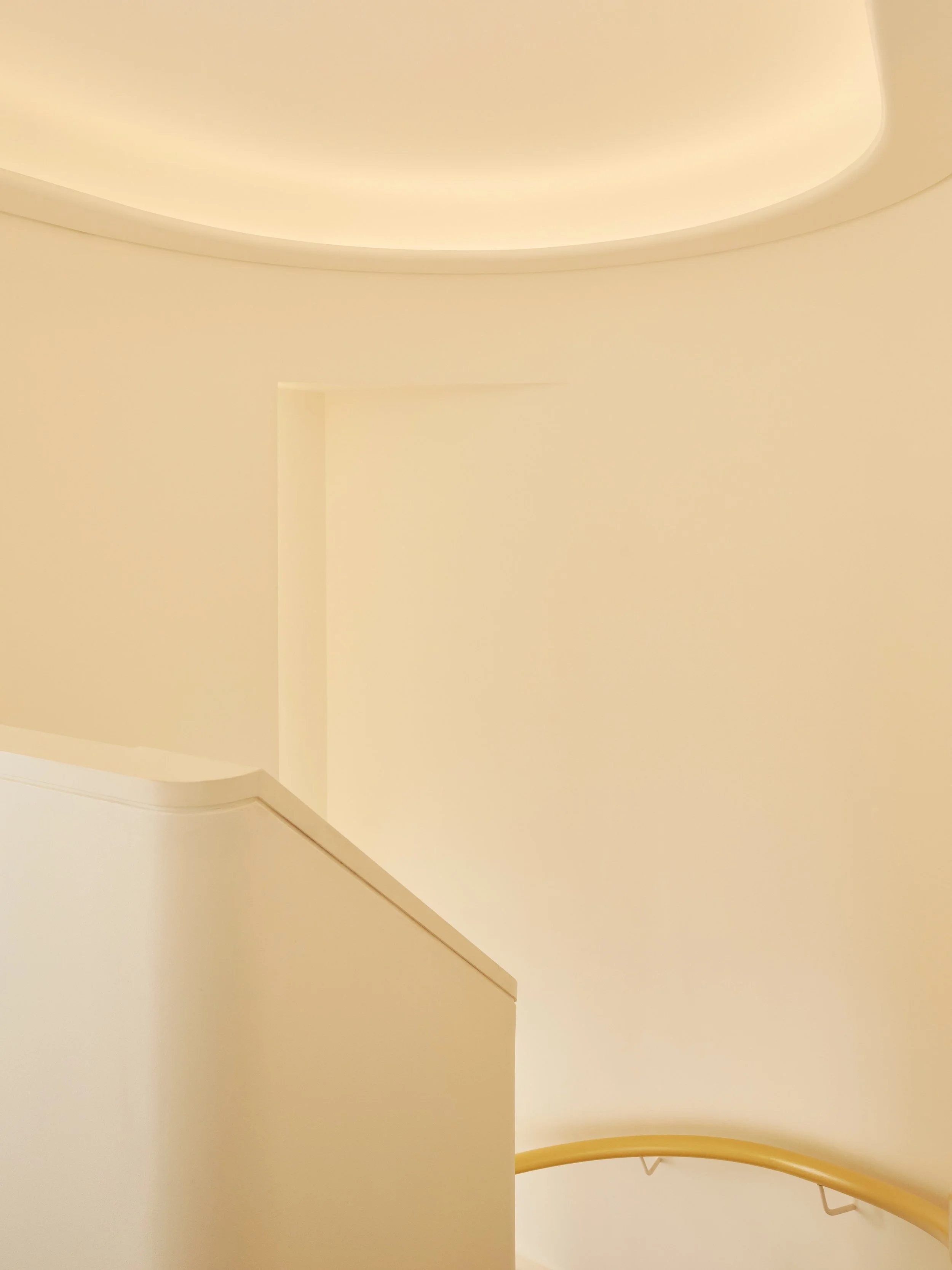 A bespoke maisonette staircase design in Central London by Studio Tashima, integrating functionality with elegant interior architecture.