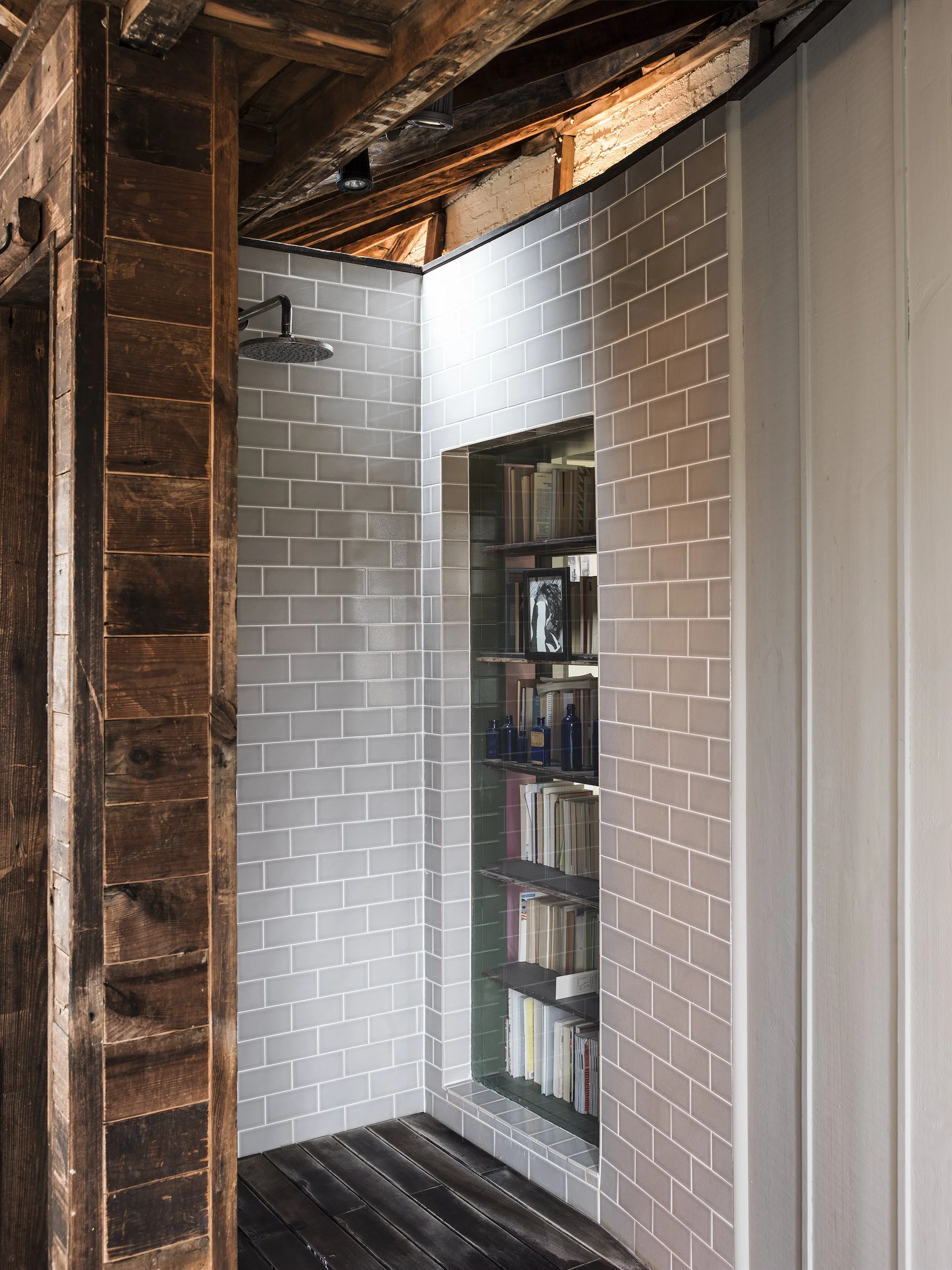 Eclectic refurbishment of a Georgian terrace house with layered interiors and a restored studio environment.