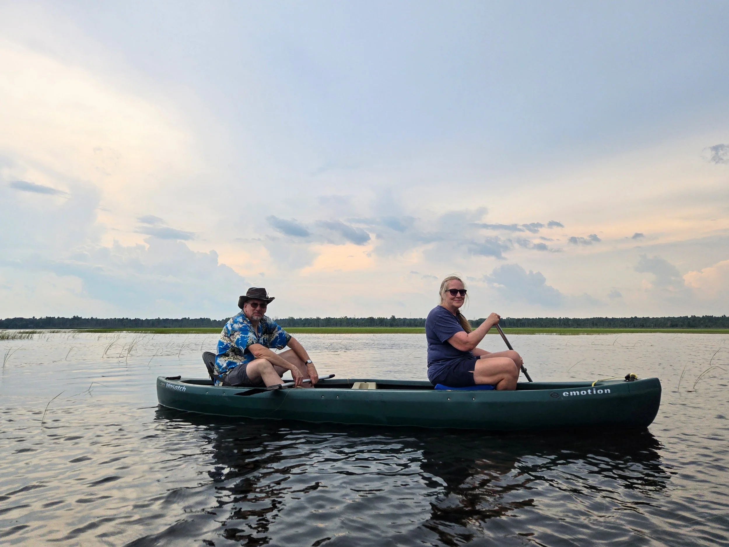 Eric and Sue Helsel paddle their canoe on Tawas Lake.