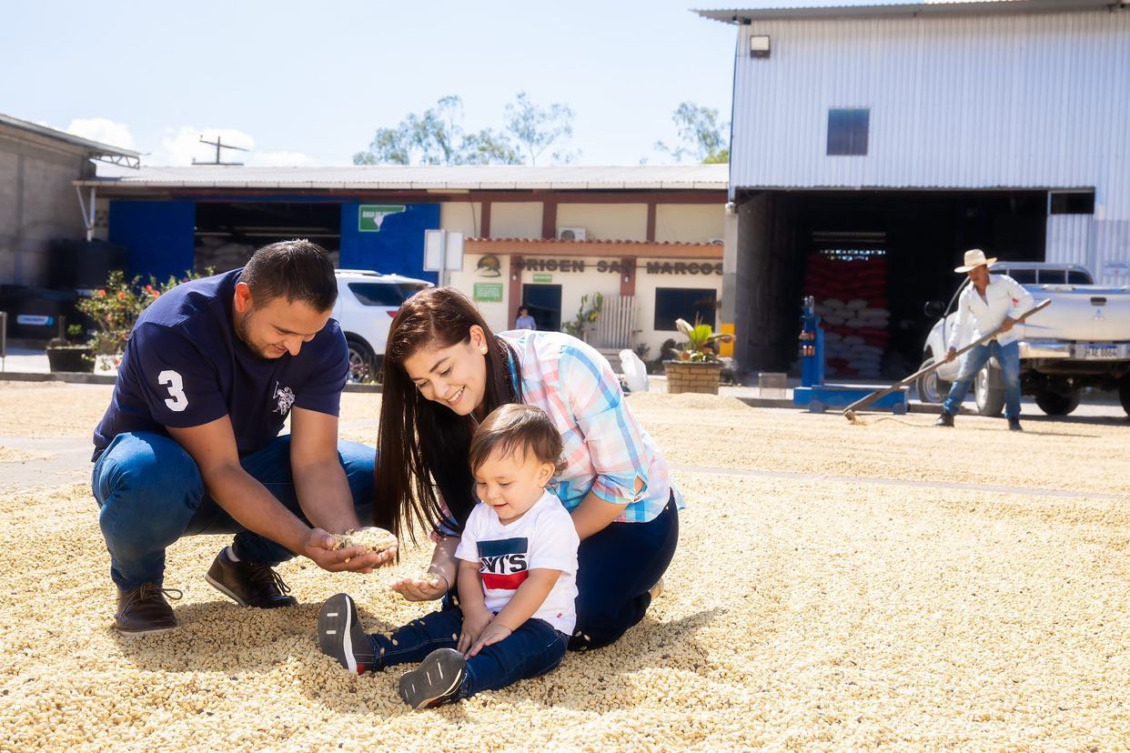  Rosely and Kevin with their son and their coffee drying.  