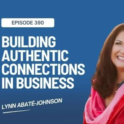 Lynn smiling, dressed in shades of red and pink, with the title "Building Authentic Connections In Business"