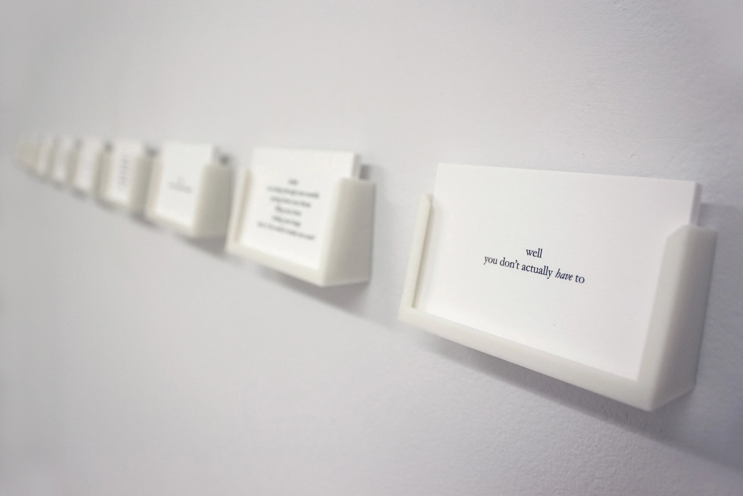 Ellen Bleiwas, Emily DiCarlo, Justine Kohleal, "Prompt", 2023. Set of 10 business cards. 2.5" x 50" x 1.5"