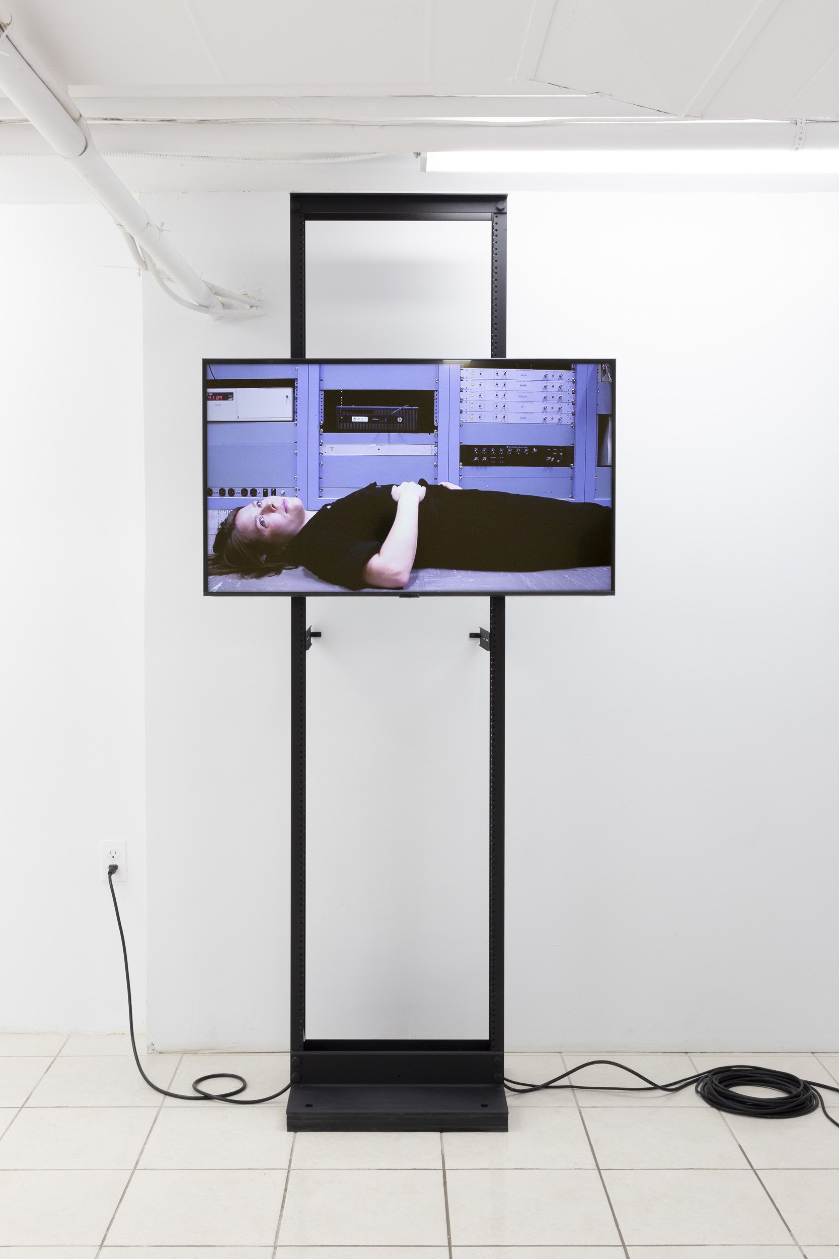 Emily DiCarlo, "The Propagation of Uncertainty", 2020. Three-channel HD video, sound, server racks. 5:40 minutes. Dimensions variable.