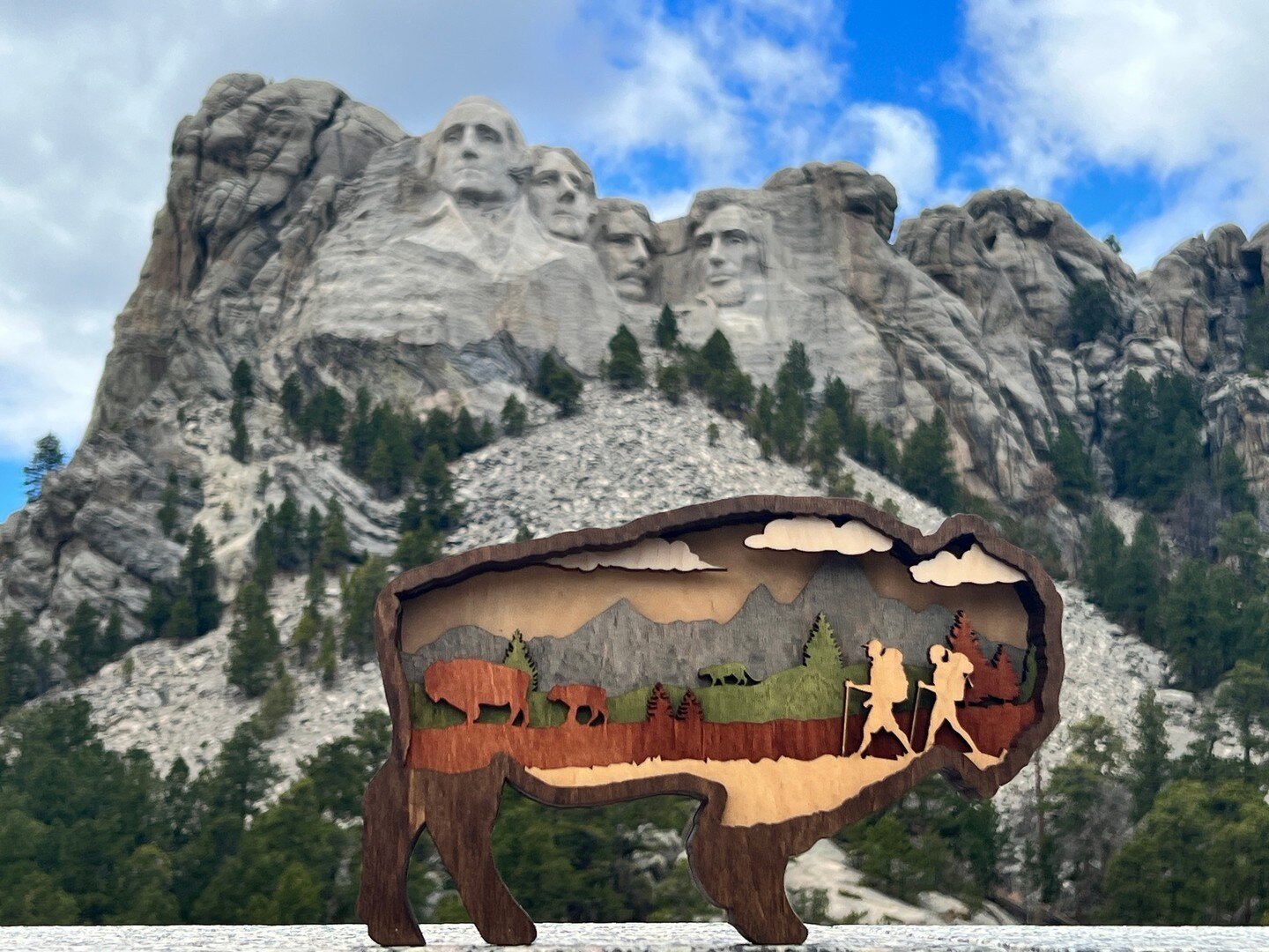 In a place where history and nature come together in such a profound way, it only seems fitting to bring along a piece of our own art 🎨🌅 Our 3D multi-layered bison represents the beauty and wonder of the American West.