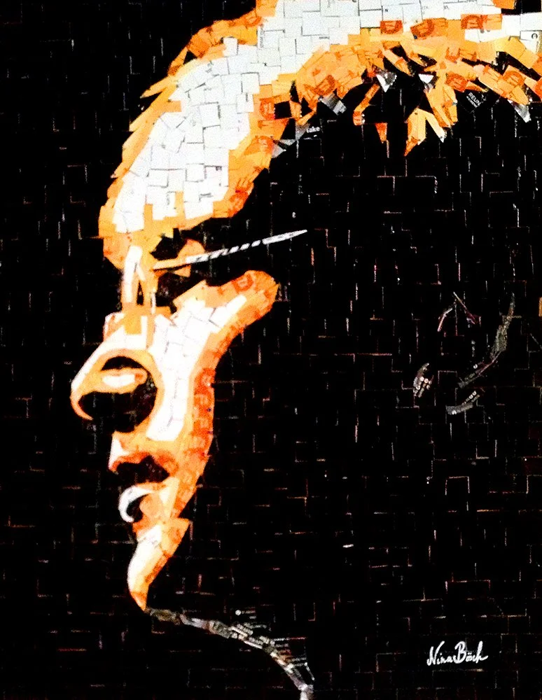 A mosaic artwork of a side profile portrait of a woman with red hair, against a black background, signed by Niam Banks.