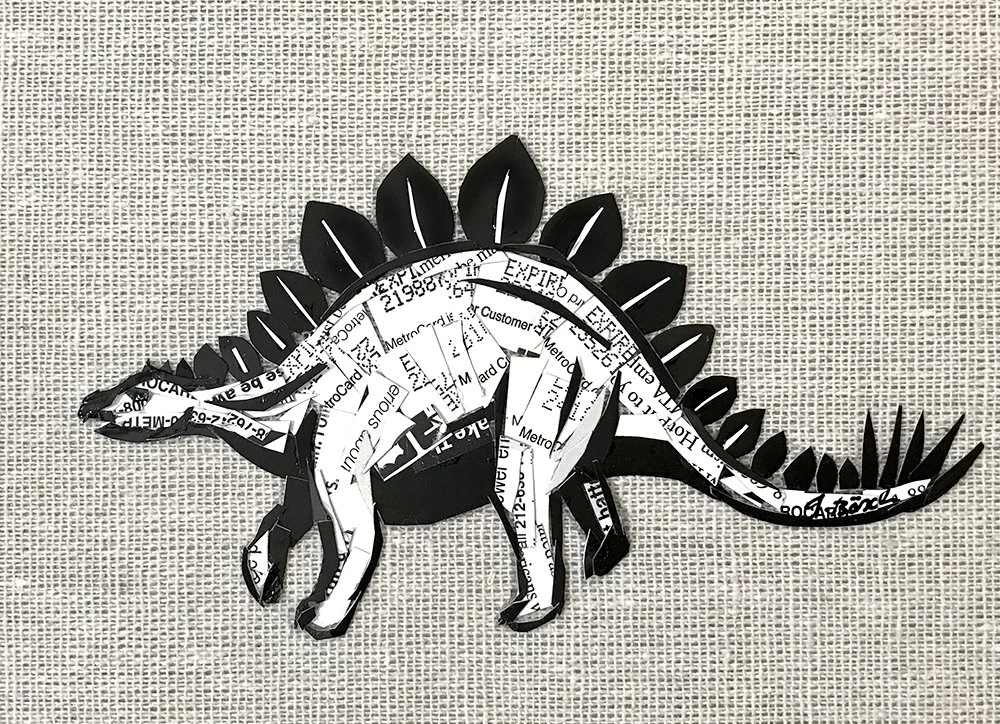 Mixed media art piece depicting a dinosaur silhouette made from black and white cutouts on a textured, beige background.
