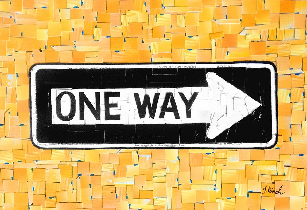 One way street sign with white background and black arrow pointing to the right, placed on a yellow cardboard background.