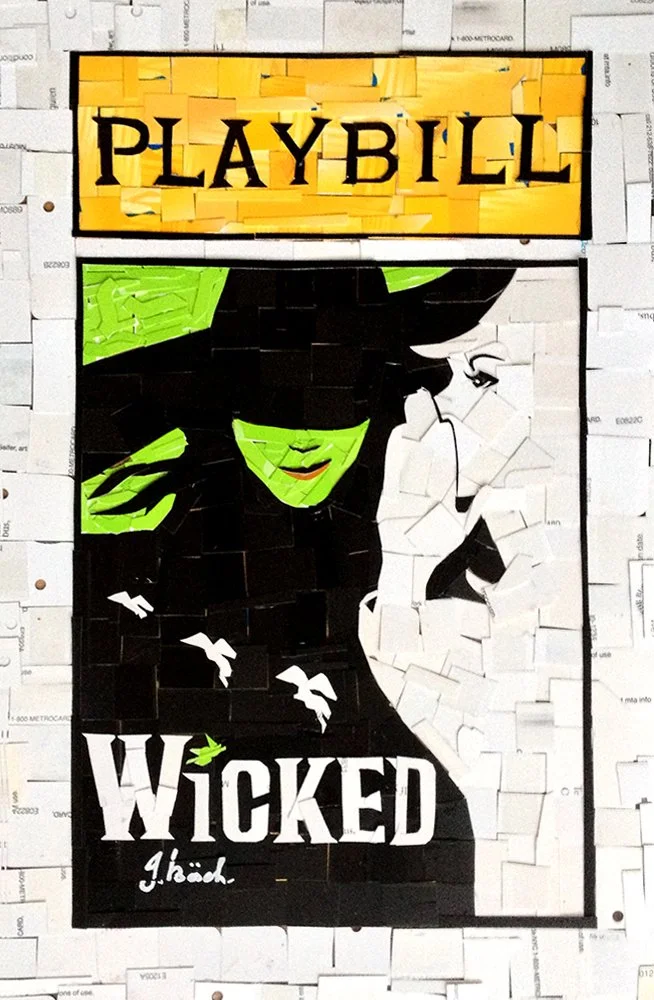 A Mosaic artwork featuring the Word "PLAYBILL" at the top, and an illustration of Elphaba from Wicked with green skin, black hat, black dress, and a white silhouette behind her. The word "WICKED" is at the bottom with a signature below it.