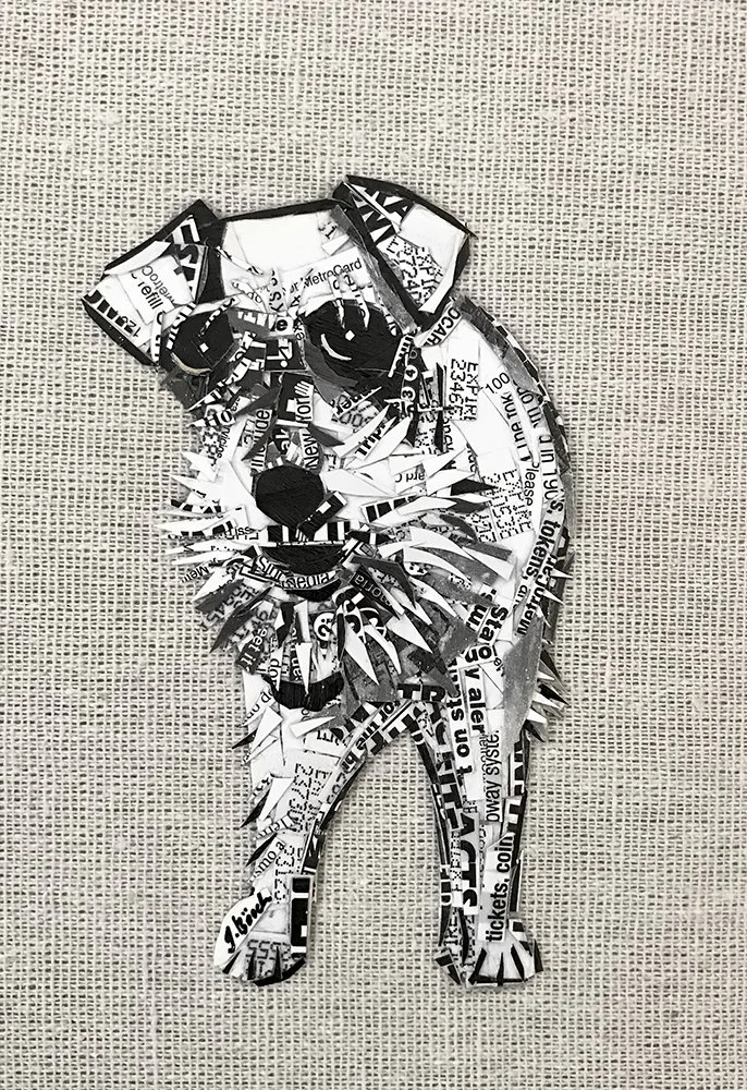 A collage of cut-out paper pieces assembled into the shape of a lion's head and body, including details like mane, eyes, nose, and limbs, on a textured background.