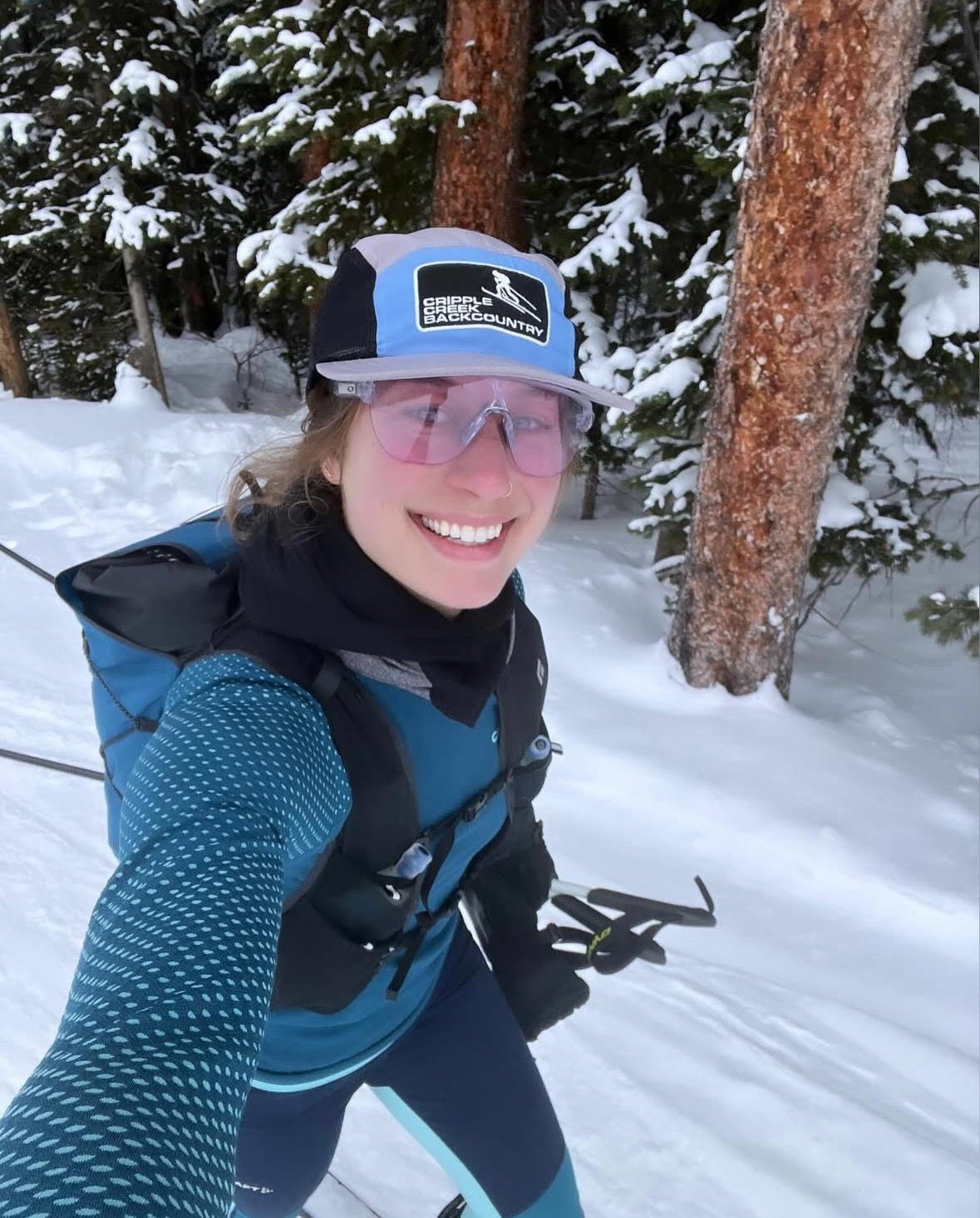 Alisha skiing in the trees