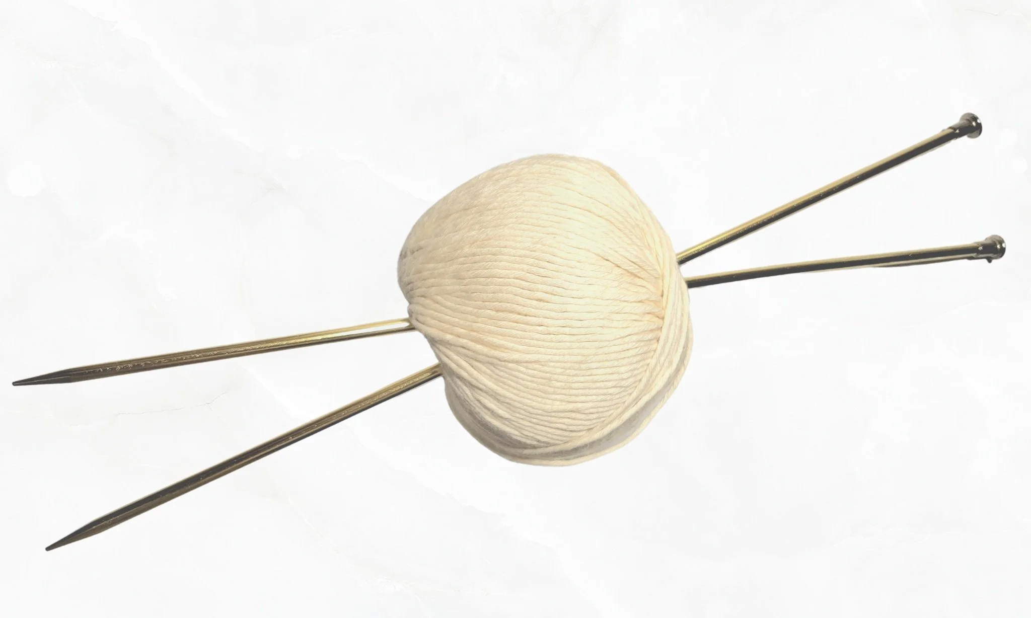 Two US 8 aluminum gold knitting needles with white cotton yarn