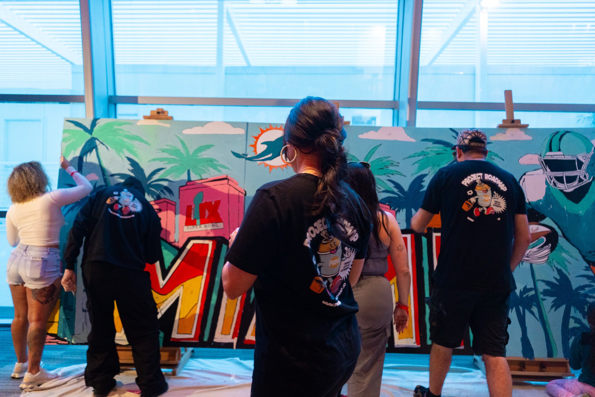 Paint by Numbers mural experience in Miami for the Super Bowl LIX Verizon FanFest Miami Dolphins by Roc Sol Project Roadmap Dee Perez Miss Lushy Miami muralist artist