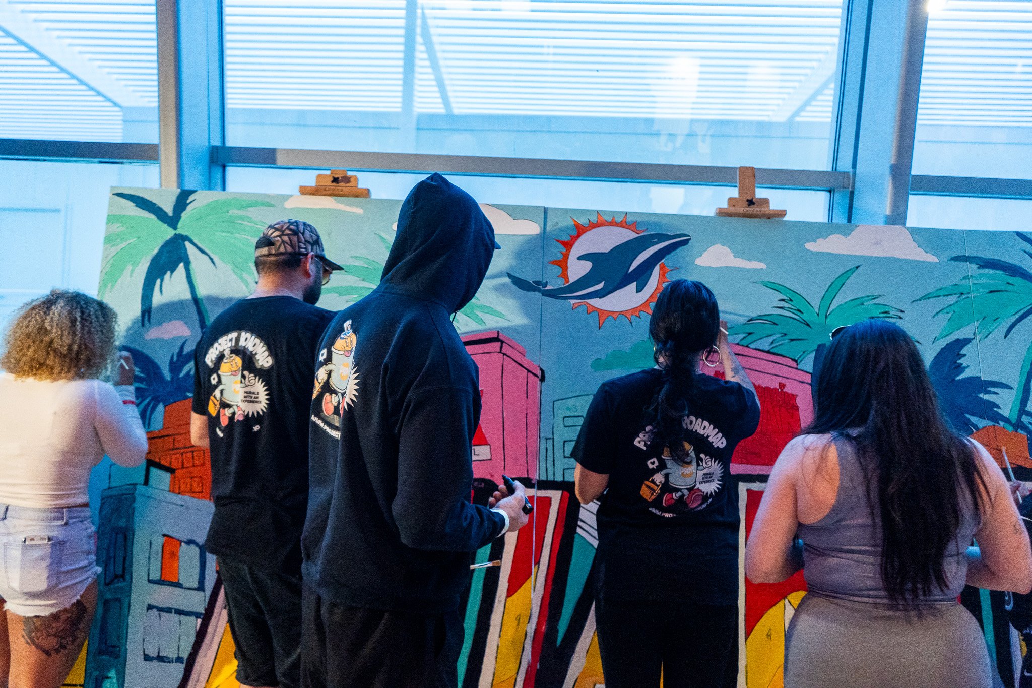 Paint by Numbers mural experience in Miami for the Super Bowl LIX Verizon FanFest Miami Dolphins by Roc Sol Project Roadmap Dee Perez Miss Lushy Miami muralist artist