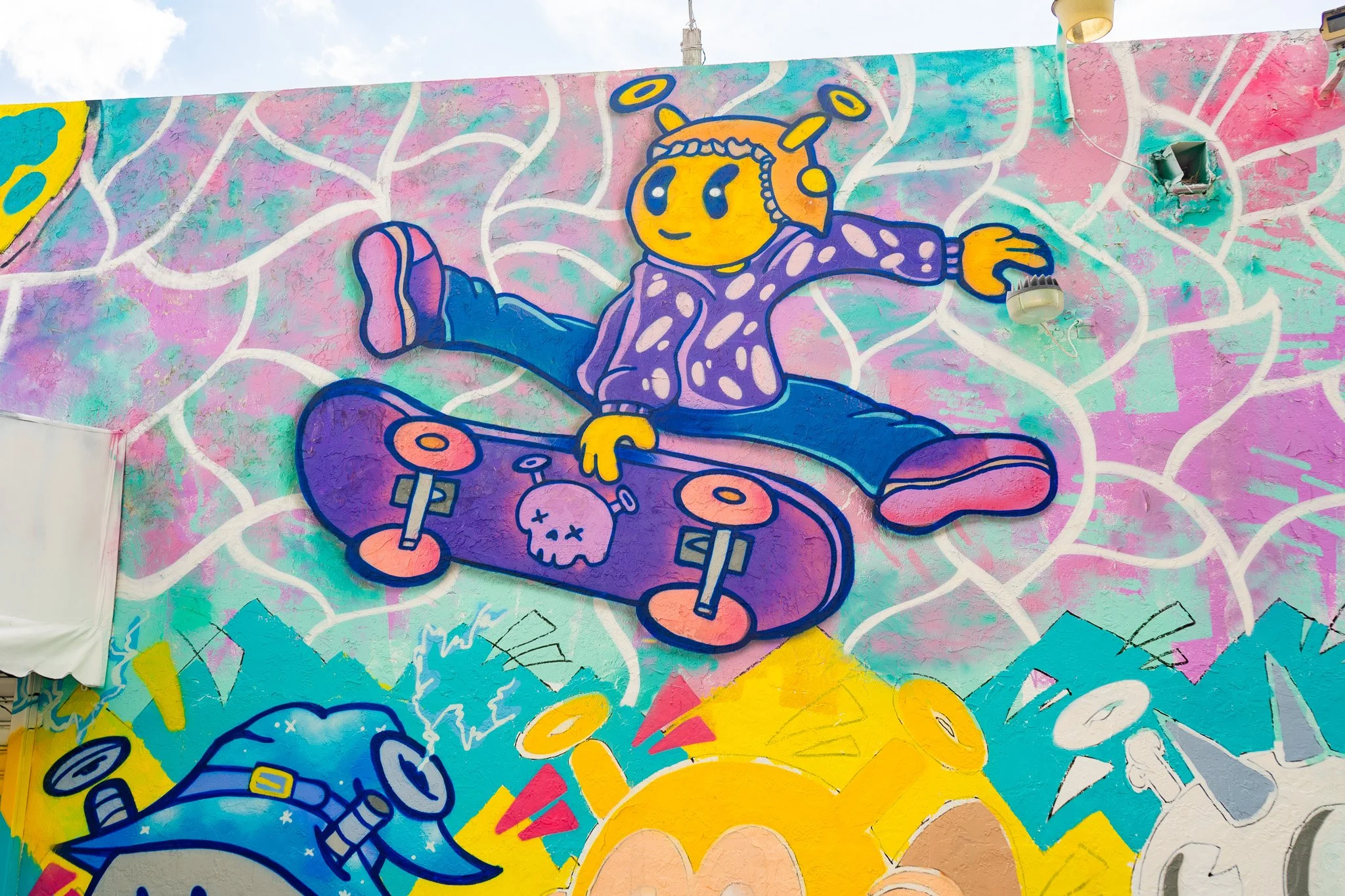 Roc Sol painting Quirkies NFT Mural in Wynwood - Web3 NFT Crypto Murals