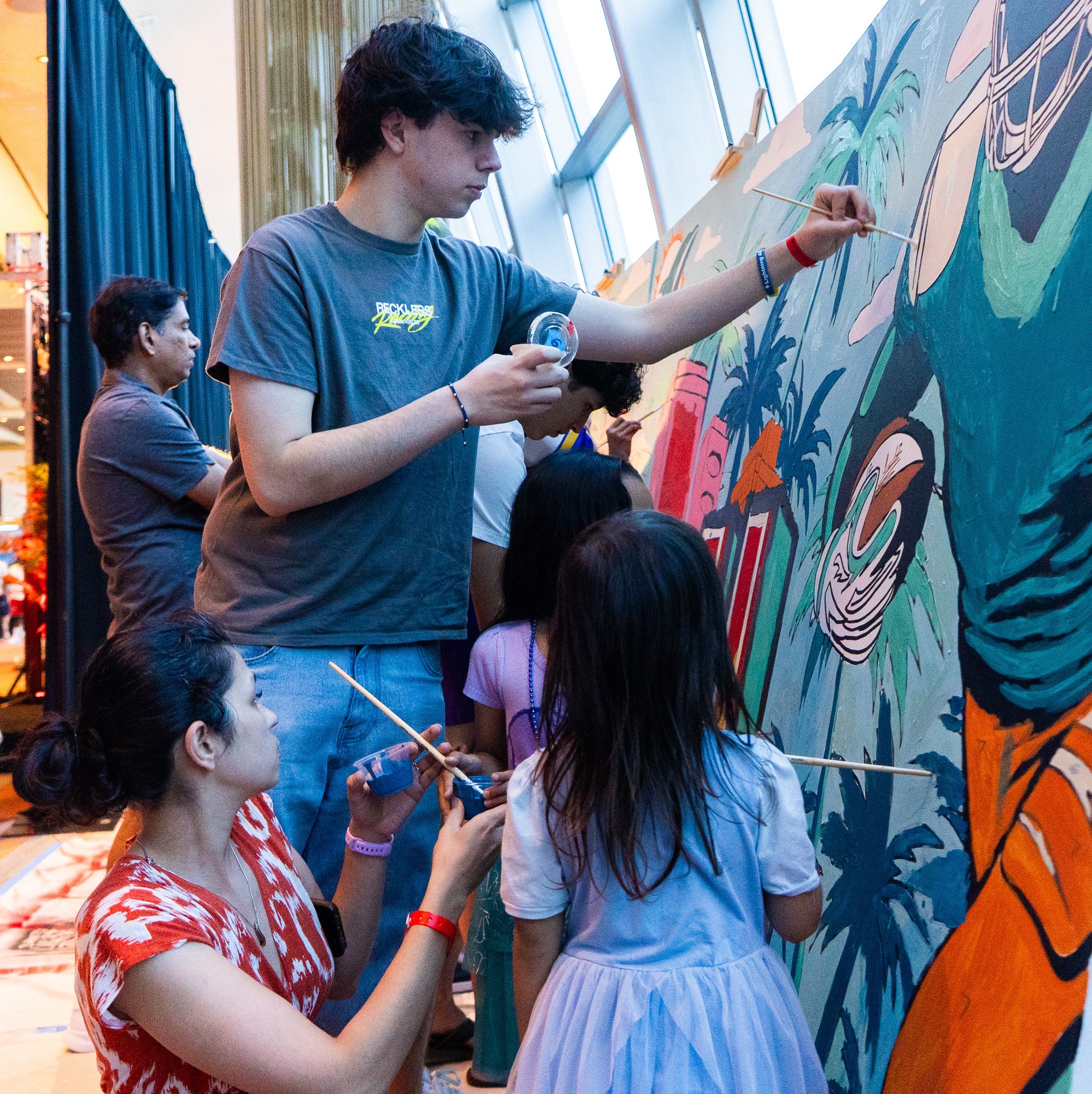 Paint by Numbers mural experience in Miami for the Super Bowl LIX Verizon FanFest Miami Dolphins by Roc Sol Project Roadmap Dee Perez Miss Lushy Miami muralist artist