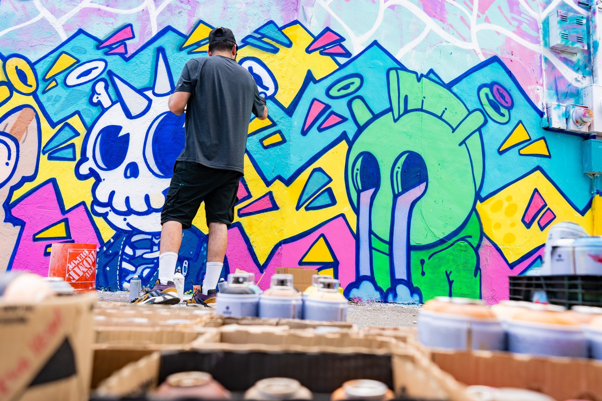 Miami Muralist Roc Sol painting Quirkies NFT Mural in Wynwood Street Art
