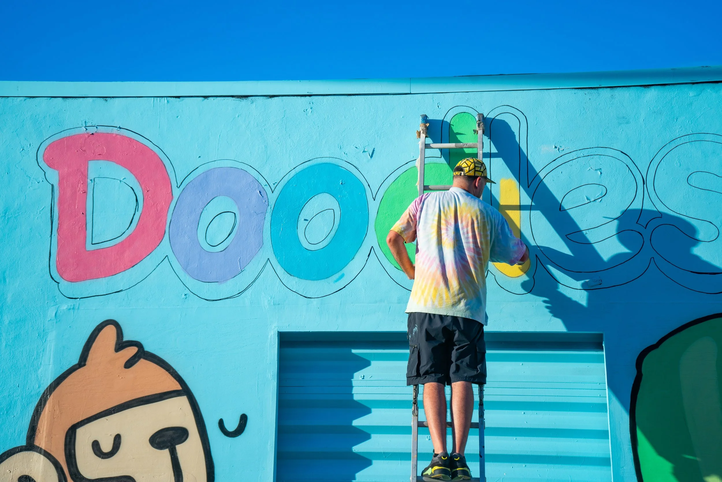 Doodles Mural - White Walls Mural - Miami Wynwood Midtown Miami Murals - Painted by Roc Sol and Dee Perez from Project Roadmap Murals - Wynwood Walls - Wynwood Mural - Miami Murals - Doodles NFT Mural - Pharrell Williams - Blondie White Walls App