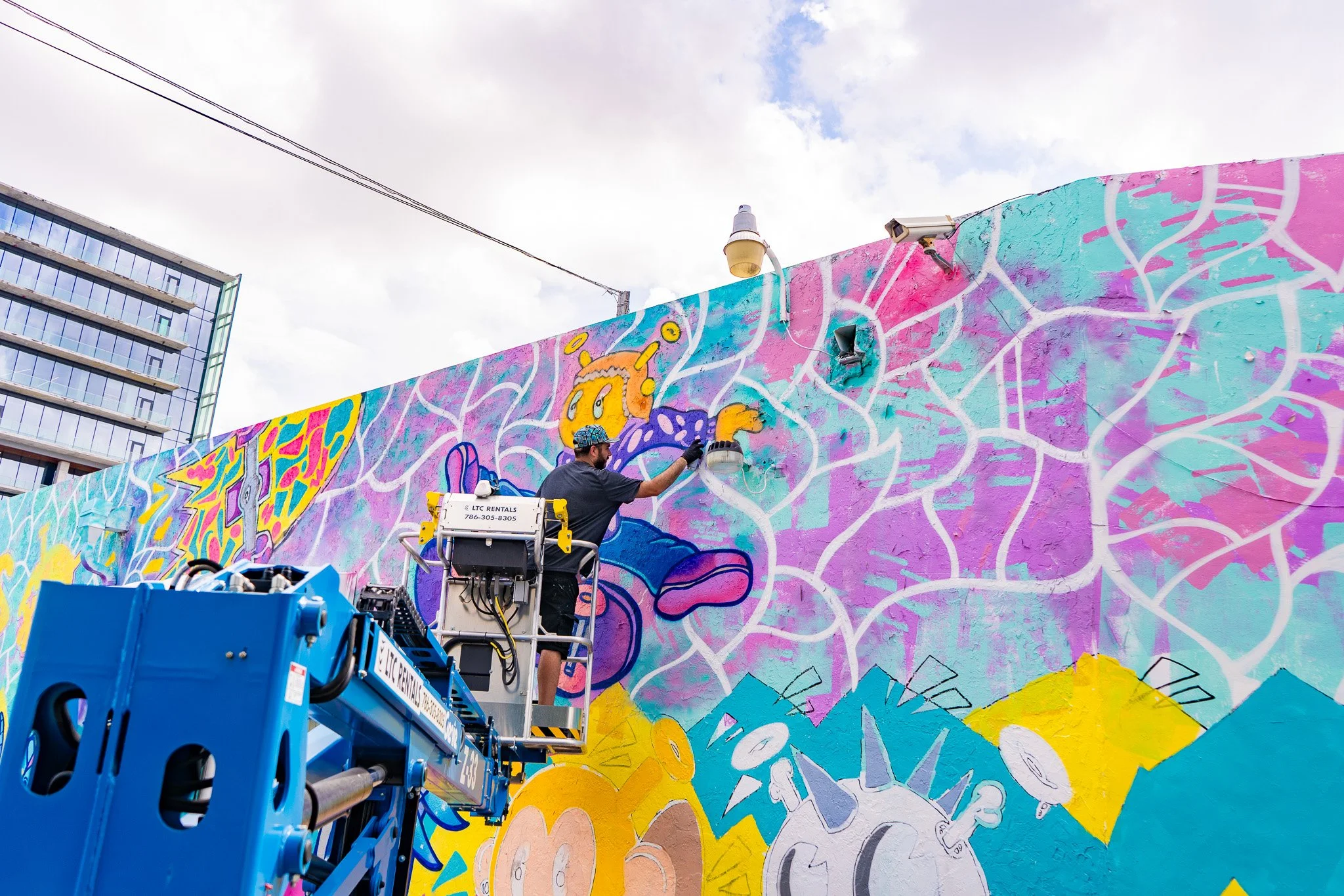Roc Sol painting Quirkies NFT Mural in Wynwood - Web3 NFT Crypto Murals