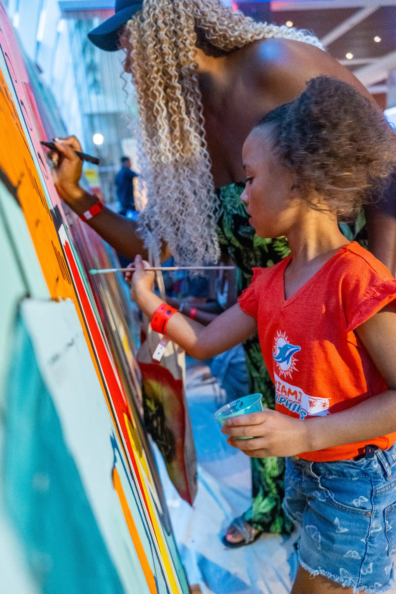 Paint by Numbers mural experience in Miami for the Super Bowl LIX Verizon FanFest Miami Dolphins by Roc Sol Project Roadmap Dee Perez Miss Lushy Miami muralist artist