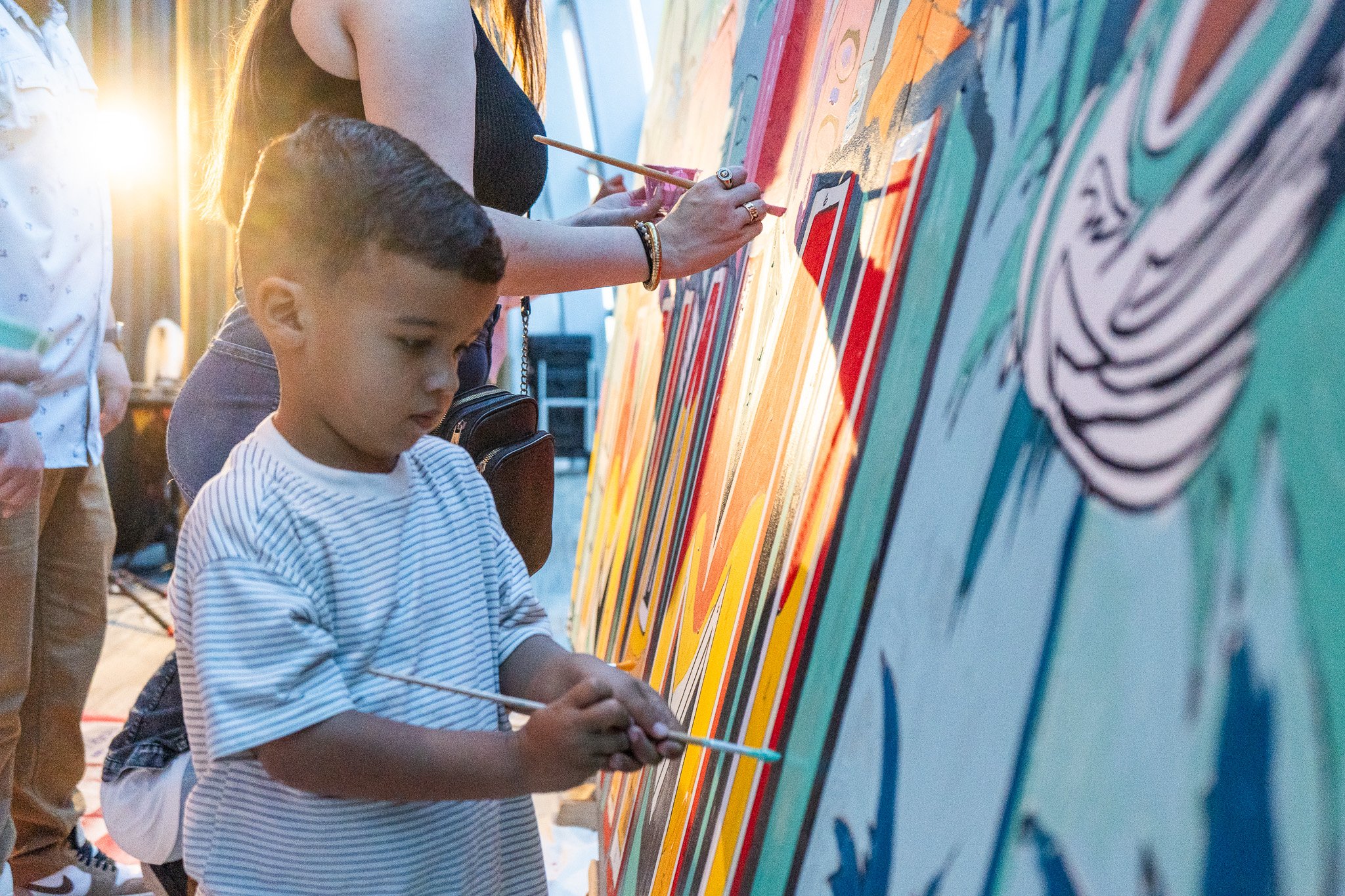 Paint by Numbers mural experience in Miami for the Super Bowl LIX Verizon FanFest Miami Dolphins by Roc Sol Project Roadmap Dee Perez Miss Lushy Miami muralist artist