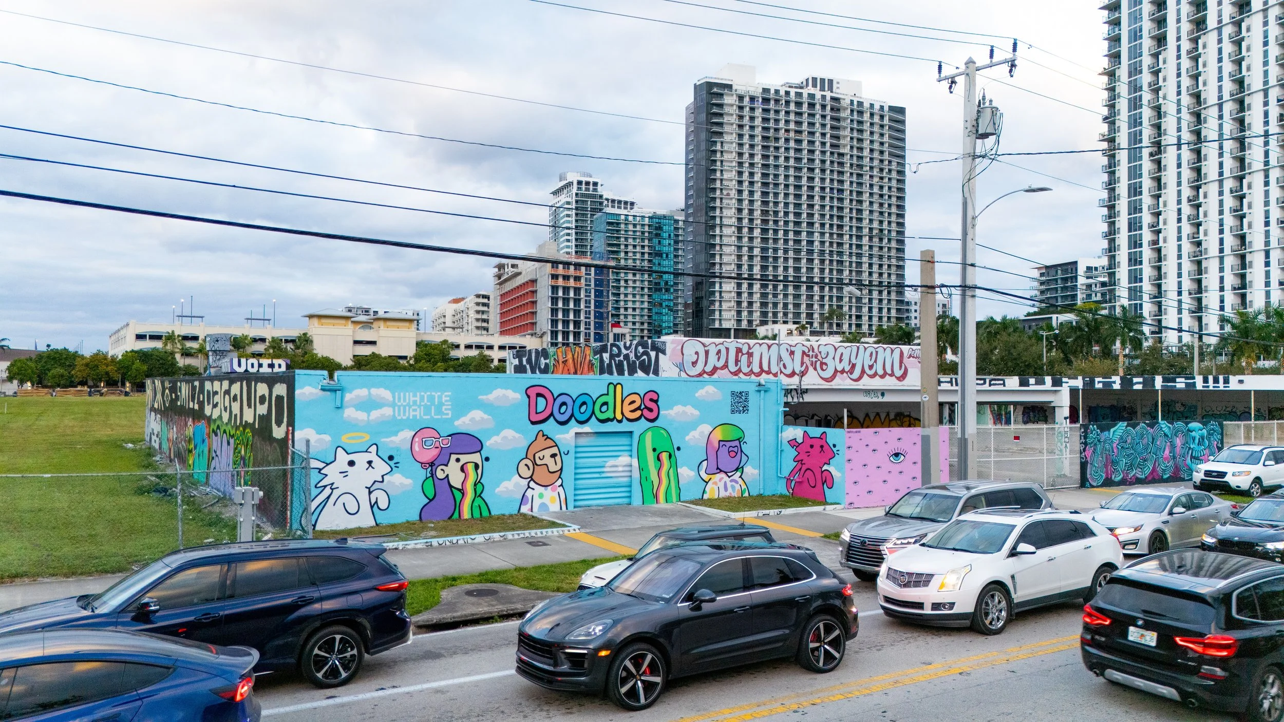 Doodles Mural - White Walls Mural - Miami Wynwood Midtown Miami Murals - Painted by Roc Sol and Dee Perez from Project Roadmap Murals - Wynwood Walls - Wynwood Mural - Miami Murals - Doodles NFT Mural - Pharrell Williams - Street Art - Public Art -