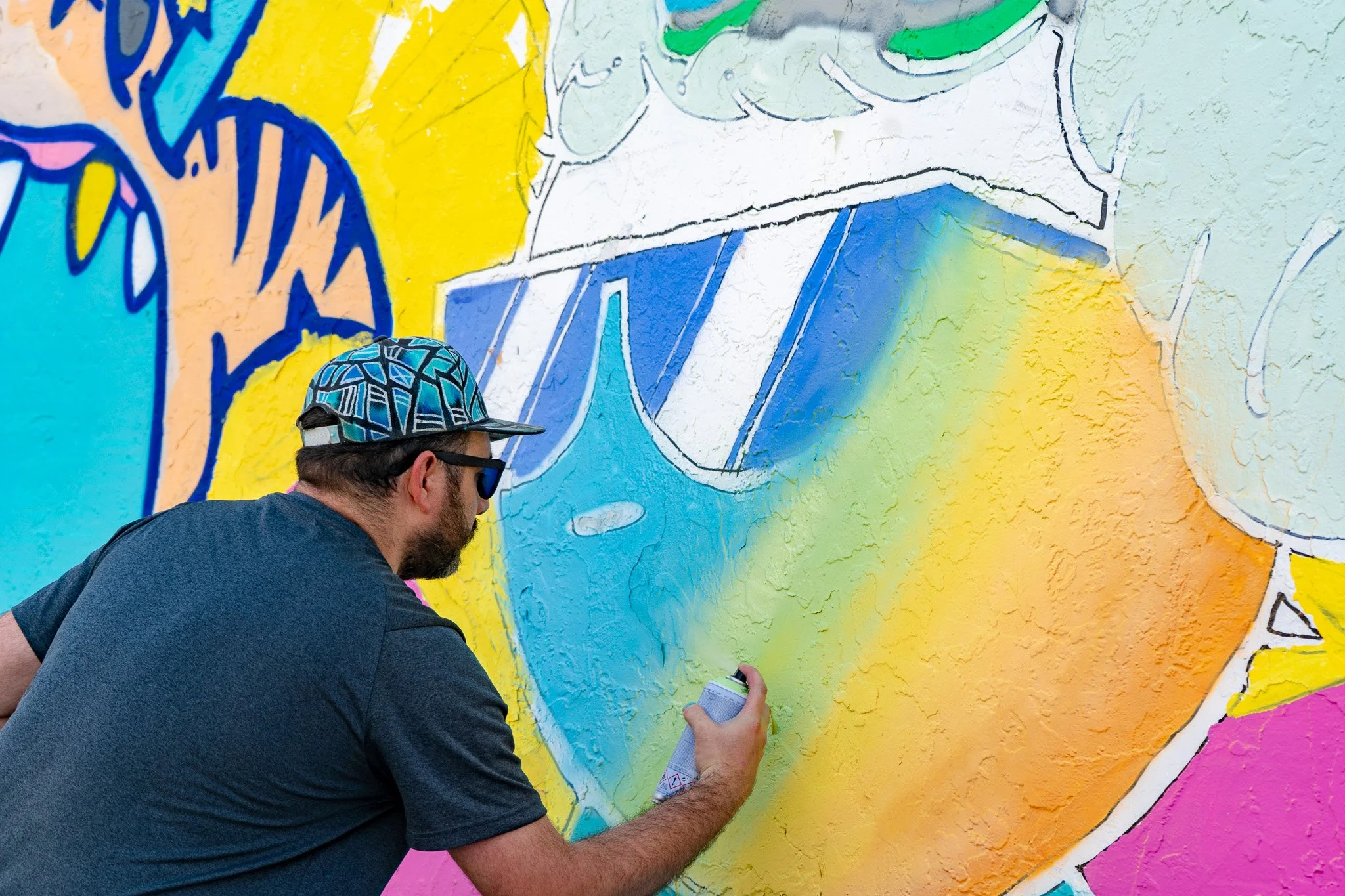 Miami Muralist Roc Sol painting Quirkies NFT Mural in Wynwood Street Art