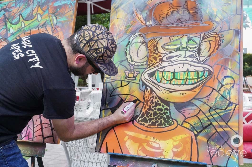 Roc Sol painting bored ape canvases live at Miami Web3 Happy Hour in Miami Beach Magic City Apes World Red Eye