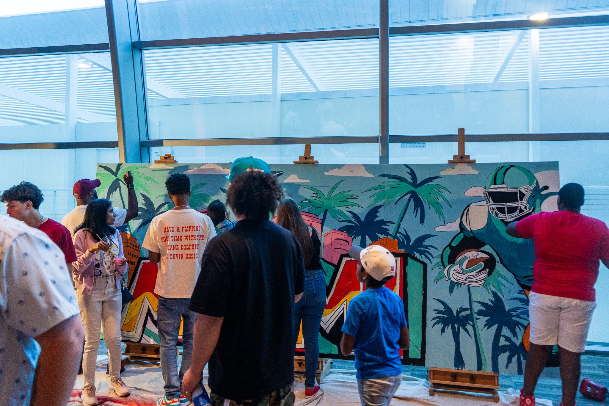 Paint by Numbers mural experience in Miami for the Super Bowl LIX Verizon FanFest Miami Dolphins by Roc Sol Project Roadmap Dee Perez Miss Lushy Miami muralist artist