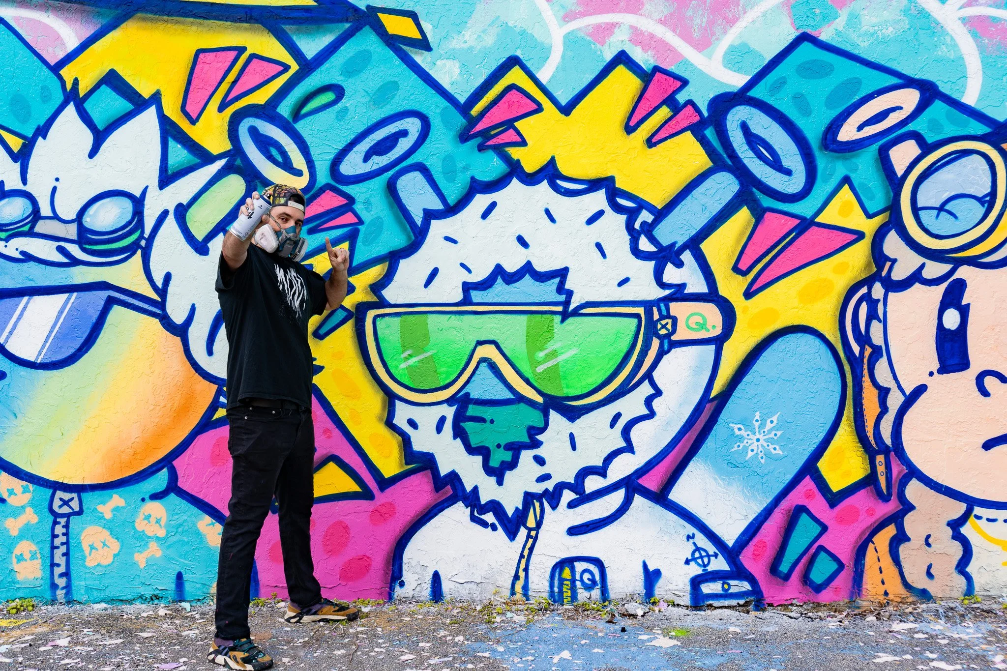 Miami Muralist Roc Sol painting Quirkies NFT Mural in Wynwood Street Art