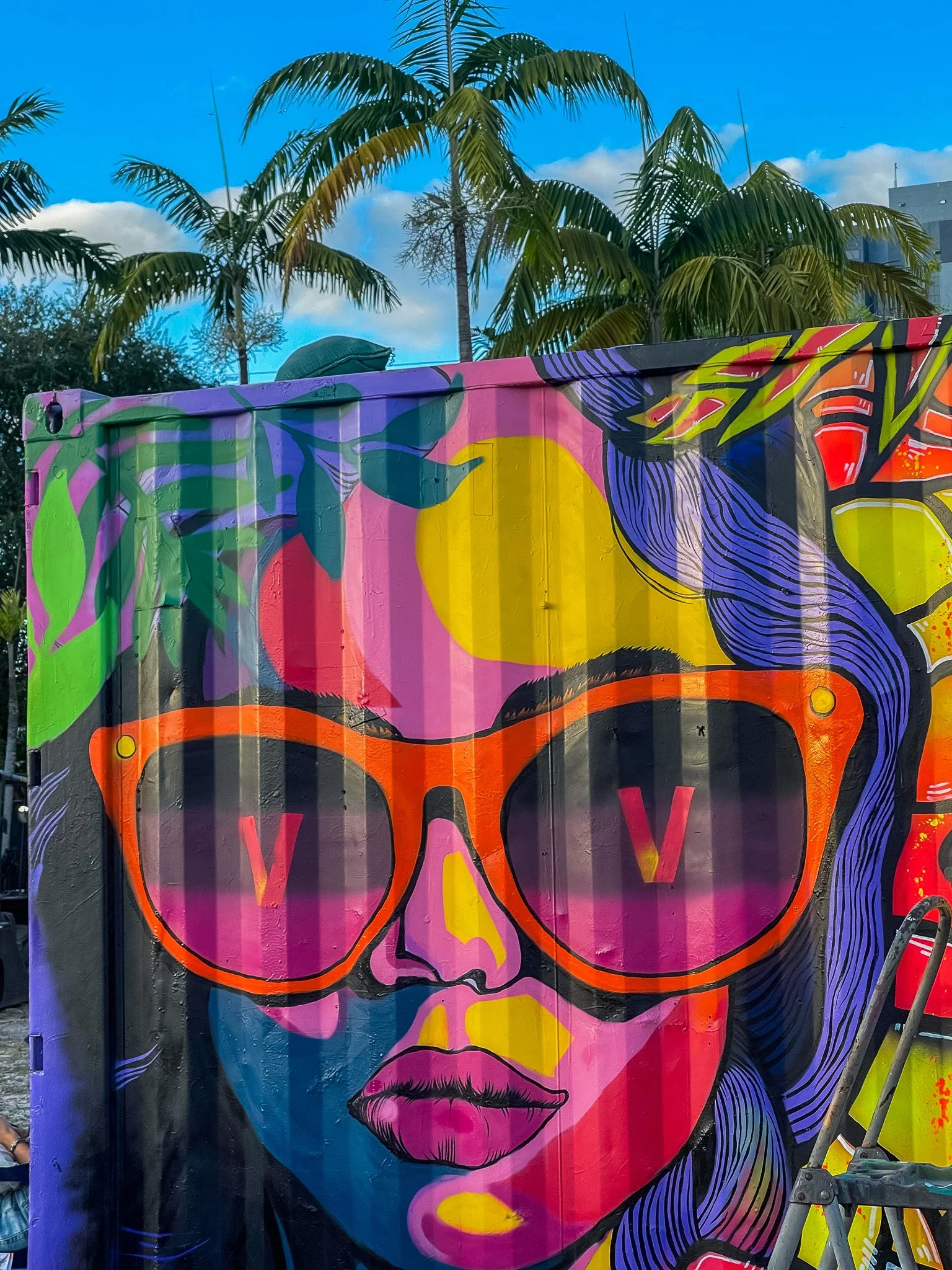 HIVE 2024 A cocktail art and culinary village in Wynwood Miami Art Week Live painting a Mural Container for Verizon Miami Art Week Art Basel Mural with Roc Sol Dee Perez and Miss Lushy with Project Roadmap Murals at The Wynwood Marketplace with DJ Fr