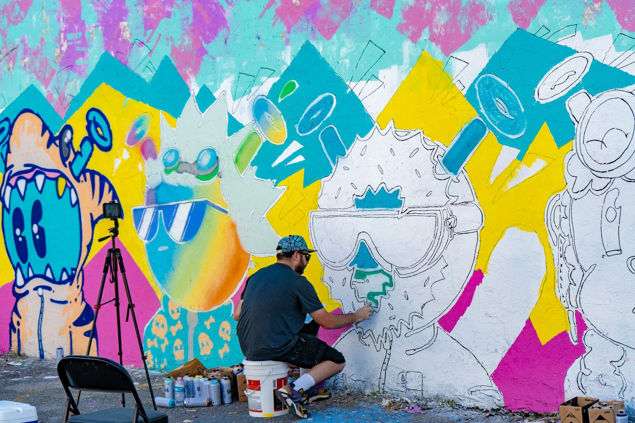 Miami Muralist Roc Sol painting Quirkies NFT Mural in Wynwood Street Art